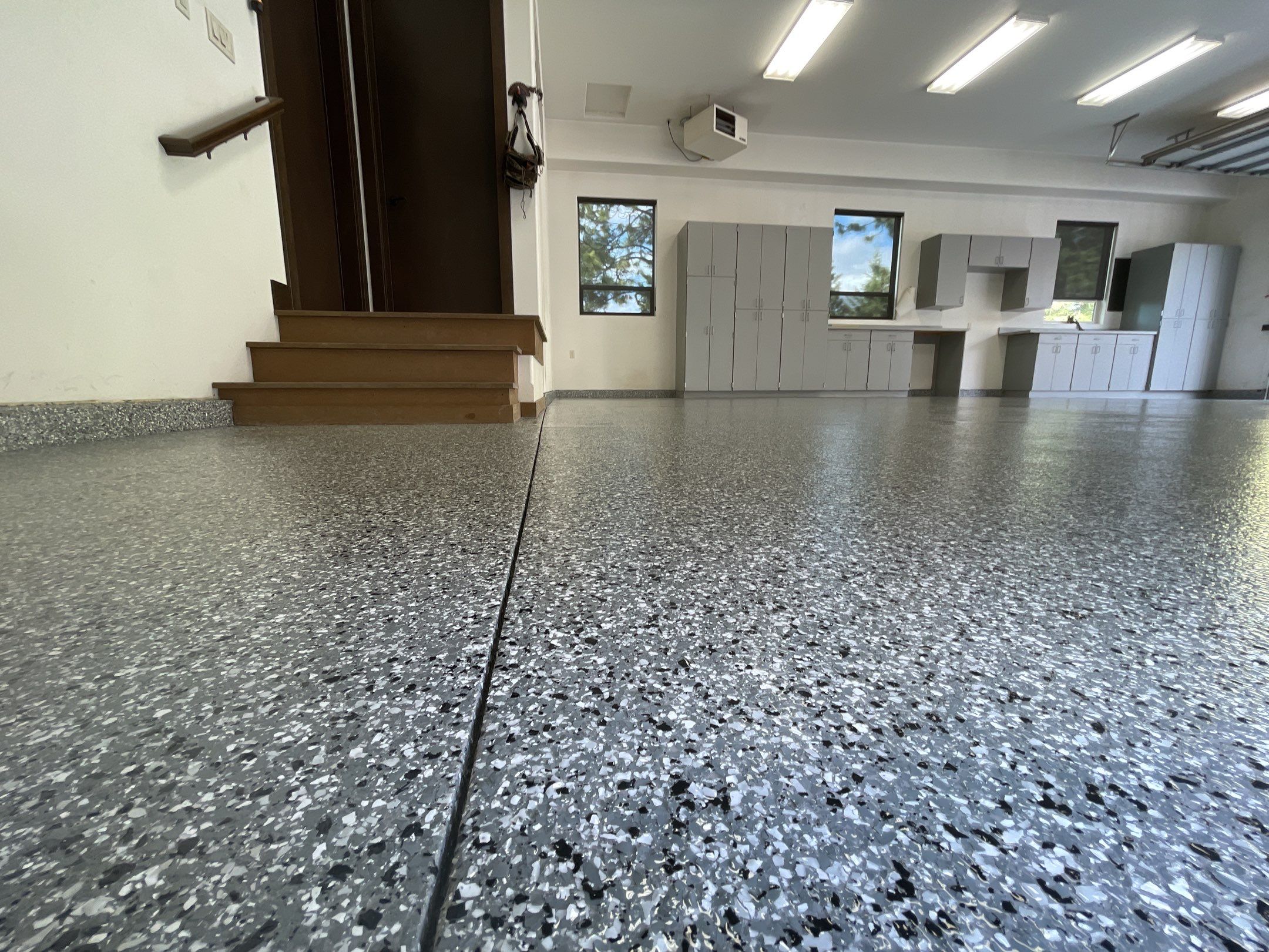 Garage Transformation using Smoke and the Penntek Evolution System by Croc Coatings, LLC