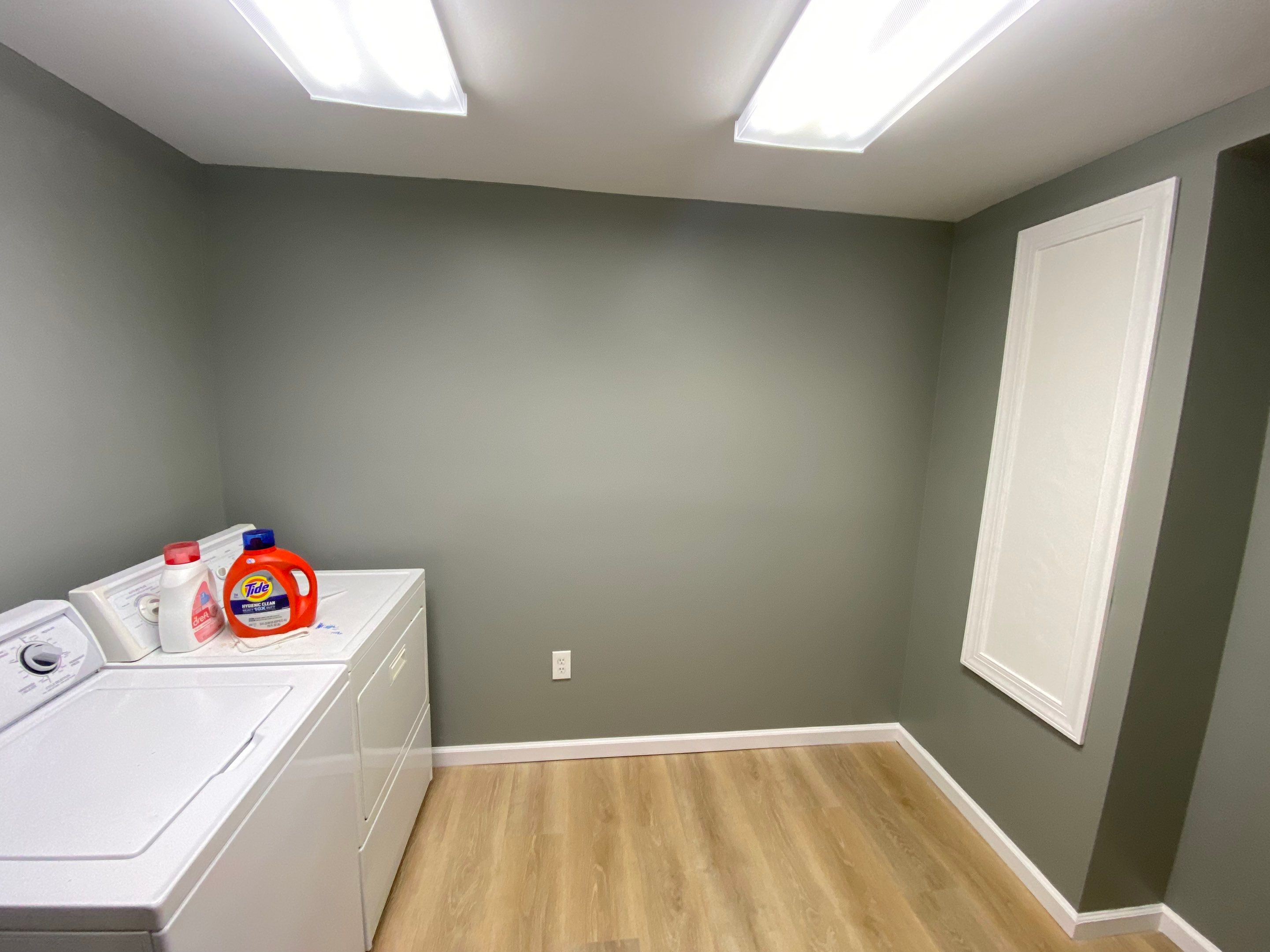 Laundry Room Redmodel using Lifeproof Luxury Vinyl Plank Flooring by The Smet Companies, LLC