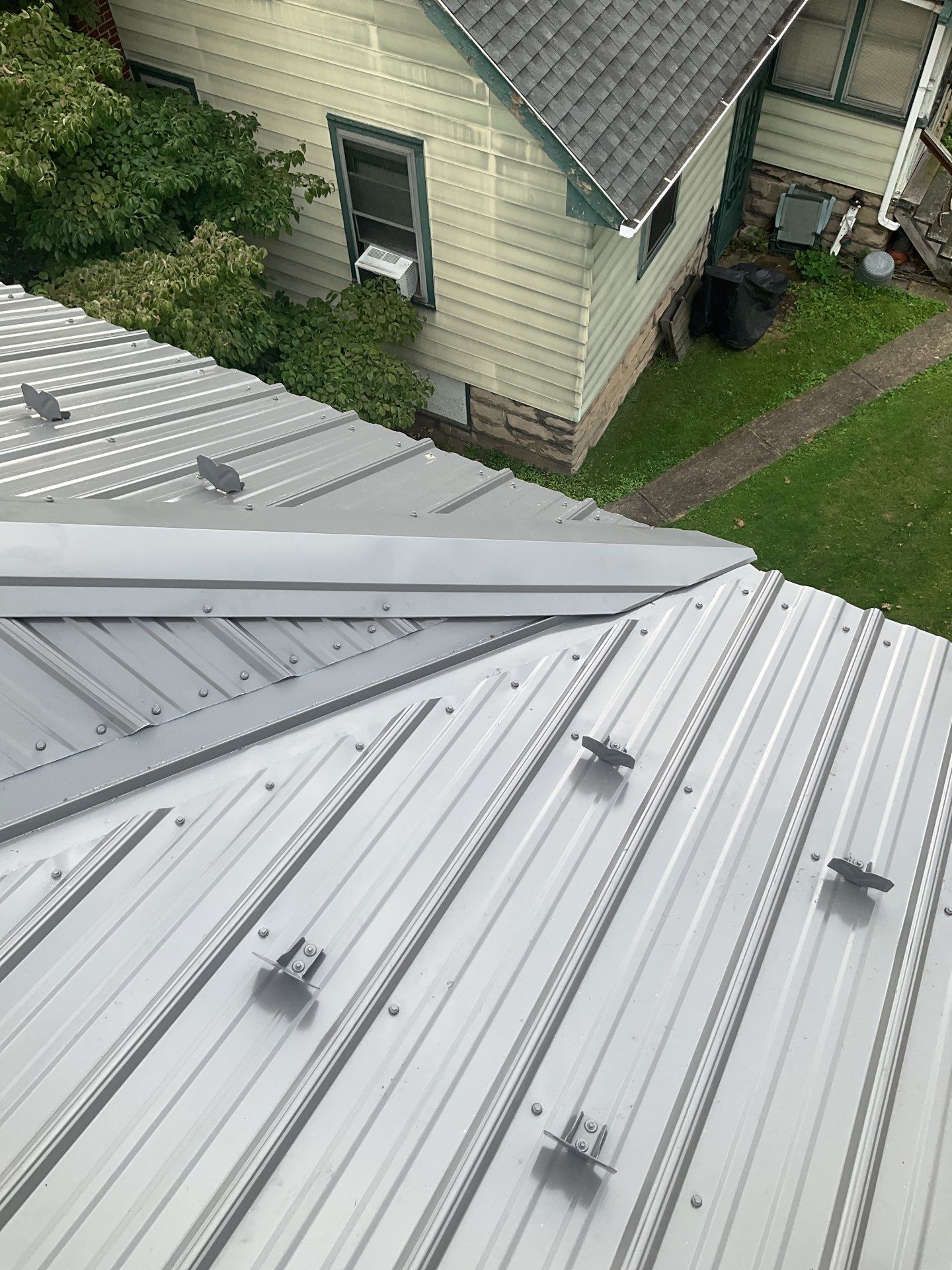 Charcoal Metal Roof & Blue Siding — A Refreshing New Look by Esh Builders