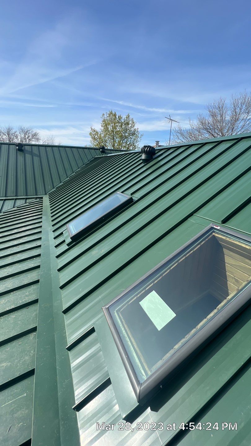 Shingle to Standing Seam Metal Roof by Springtree Restoration 