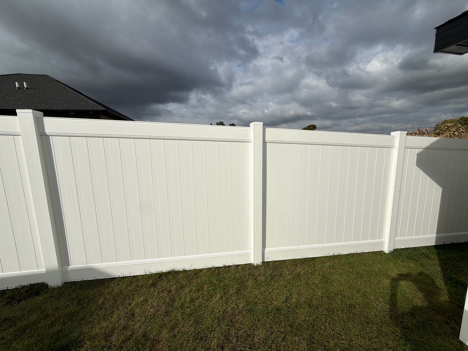 Residential White Vinyl Privacy Fence Installation in Janesville by Perfect Picket Fence and Stain