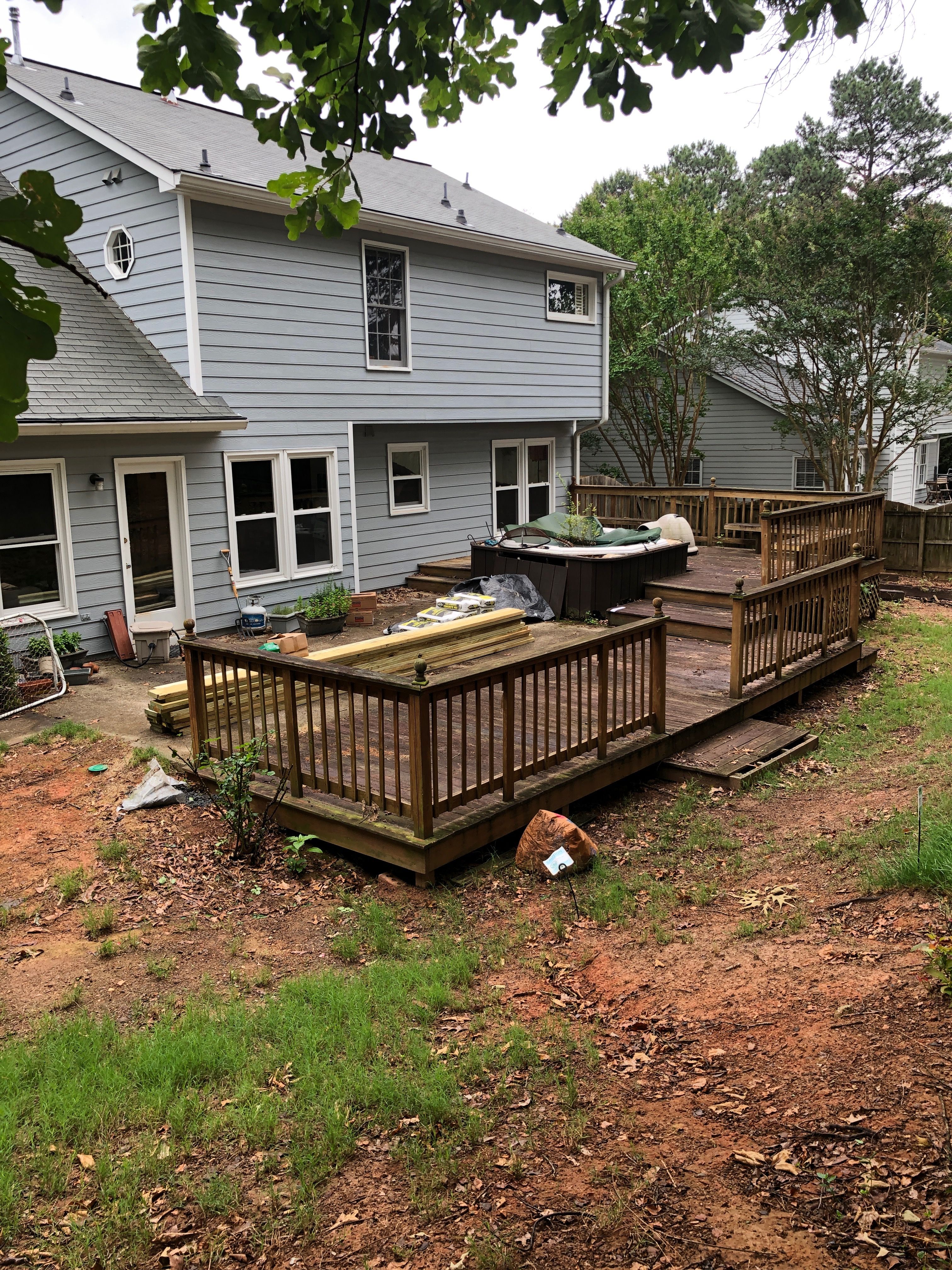 Composite Deck Replacement with White Railings in Duluth by Swift Home Renovations