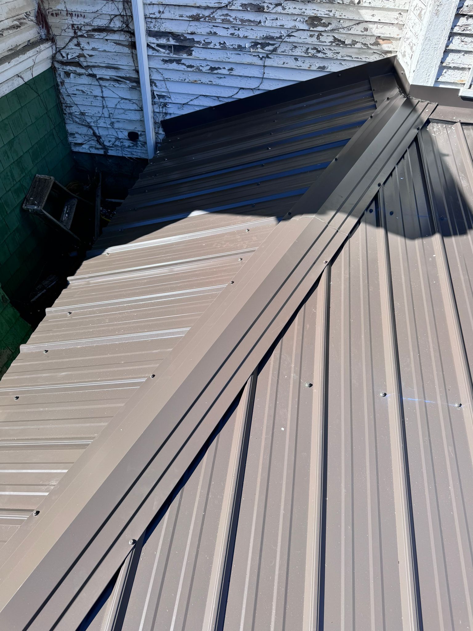 Roof Replacement using Metal by Rainstoppers Roofing
