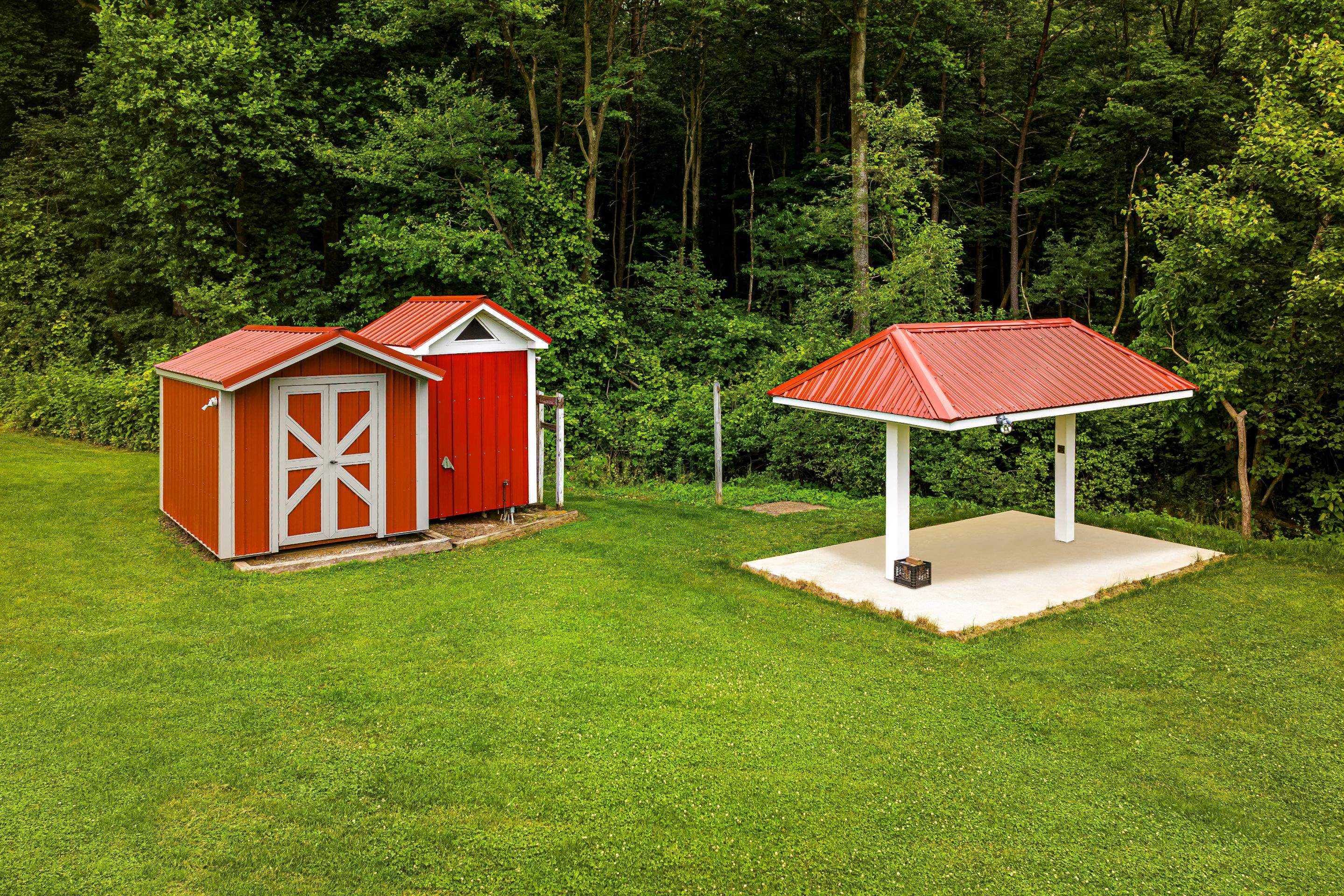 Metal roof -barn red, and New garage by Esh Builders