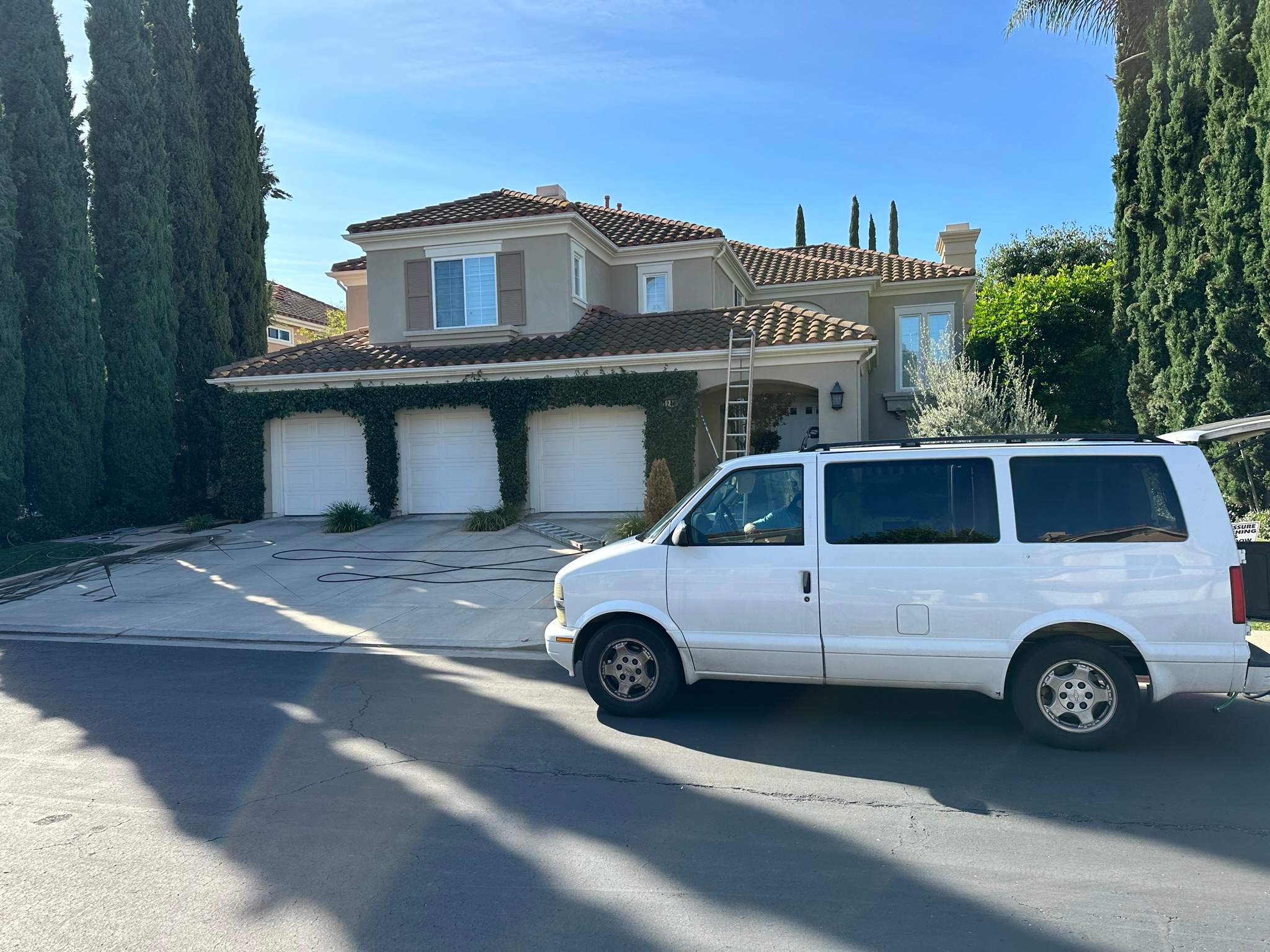 Roof wash on this dirty roof covered in algae by Property Cleaning Experts, LLC