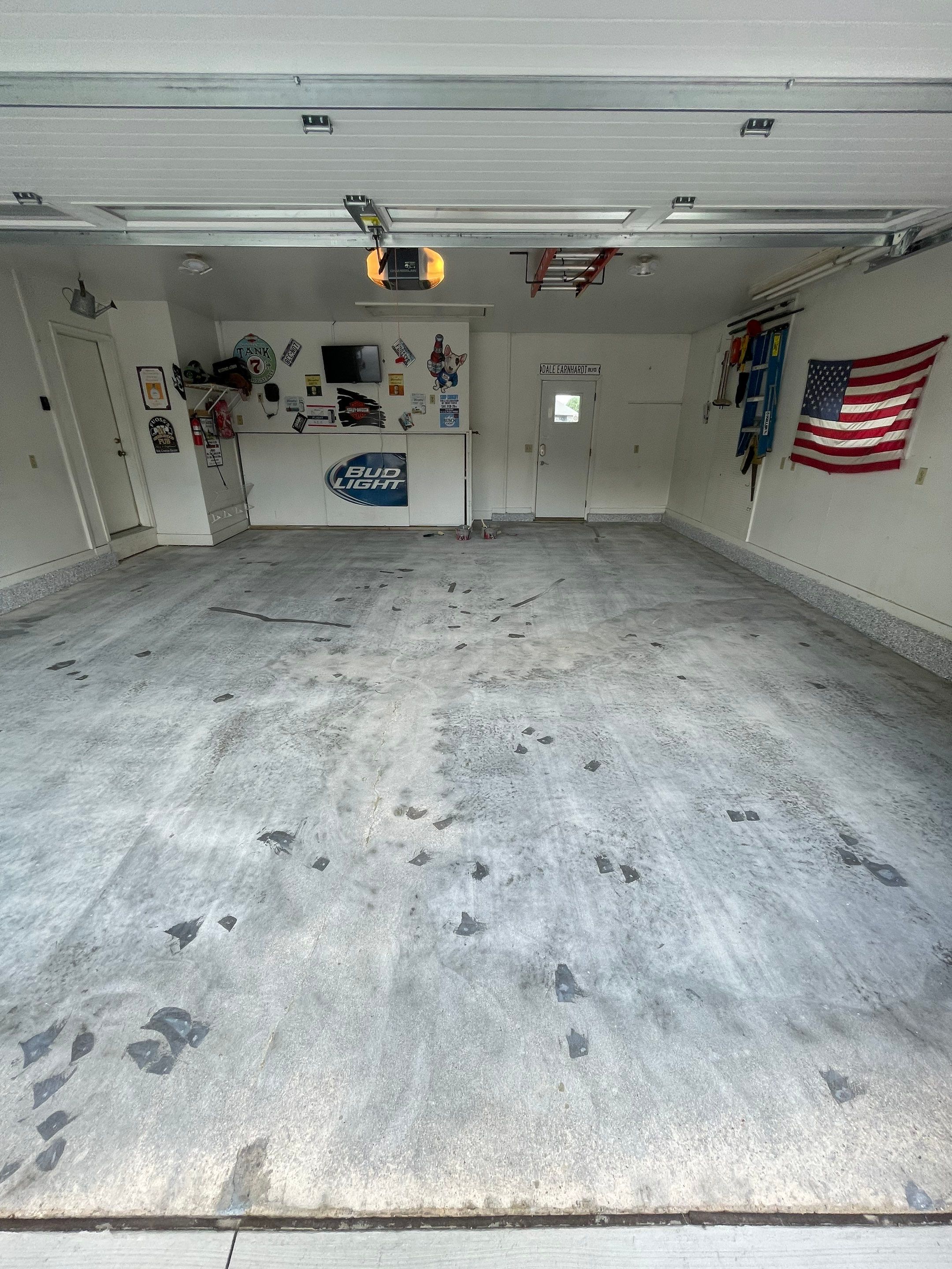 Residential Garage Floor Coating with Feather Grey Finish in Sioux Falls by Select Painting, Coatings & Garage Cabinets