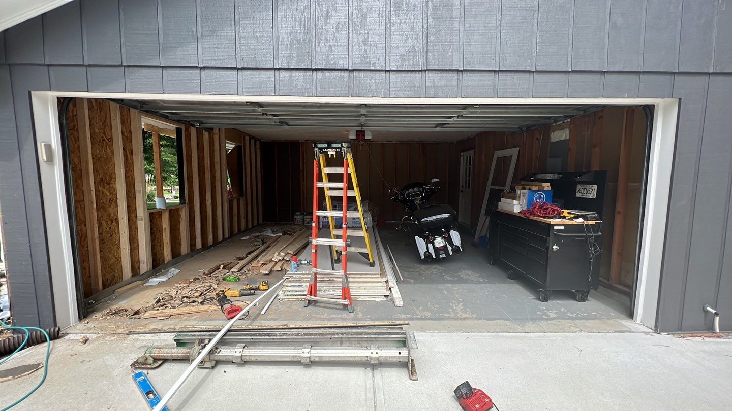 Snellville Garage Remodel Featuring Epoxy Floors and Board and Batten Siding by Swift Home Renovations