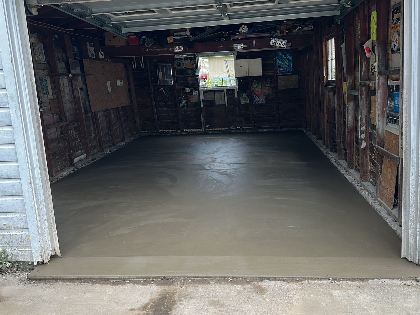 Broom finished patio and garage floor replacement  by NG Masonry & Construction LLC