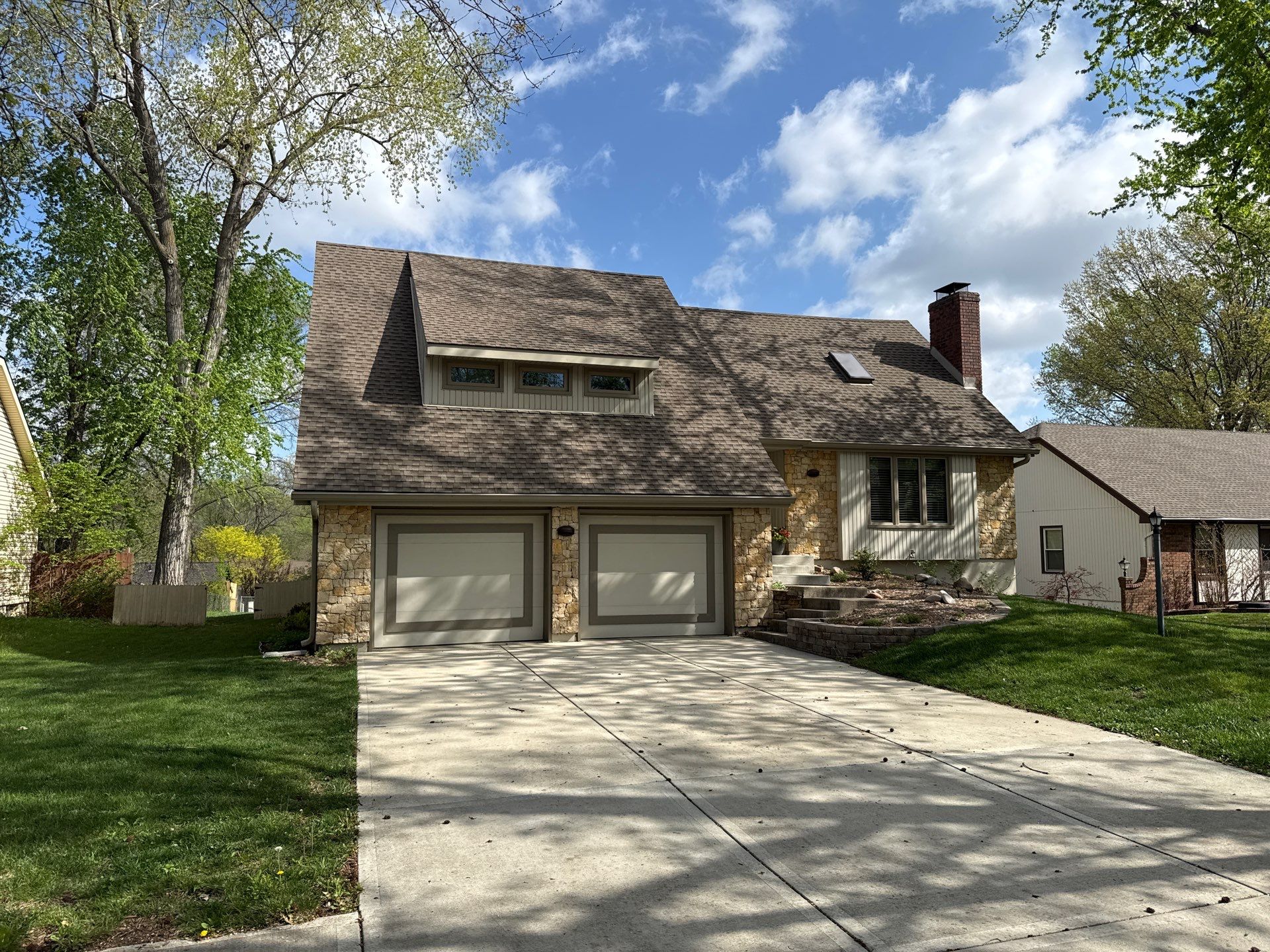 Comprehensive Kansas City Exterior Remodel Featuring Board And Batten Siding by EEC Windows, Siding & Roofing