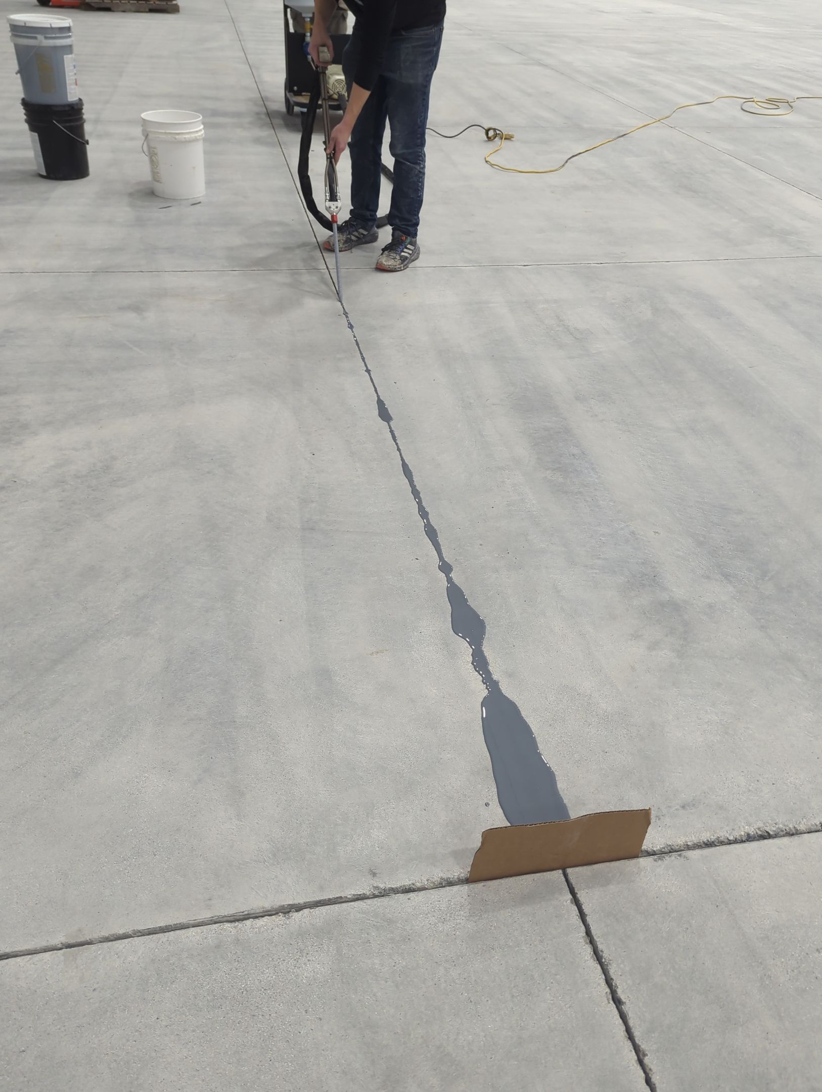 Airplane Hanger using Light Grey Commercial Penntek Epoxy by Croc Coatings, LLC