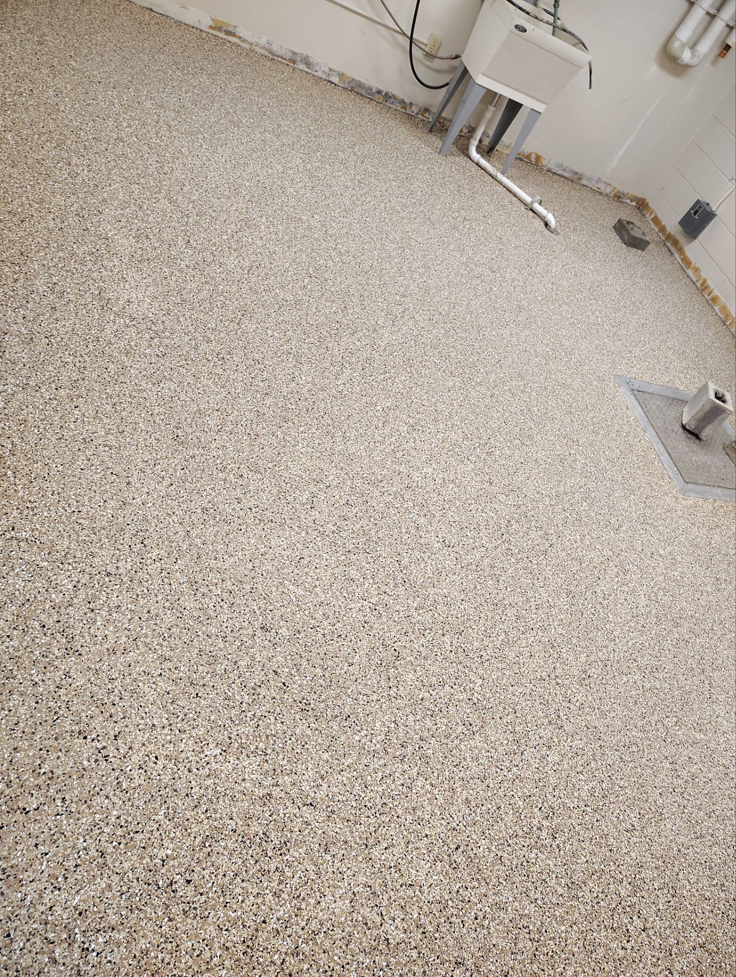 Industrial Flake Epoxy Floor Installation at Pierre National Guard Facility by Select Painting, Coatings & Garage Cabinets