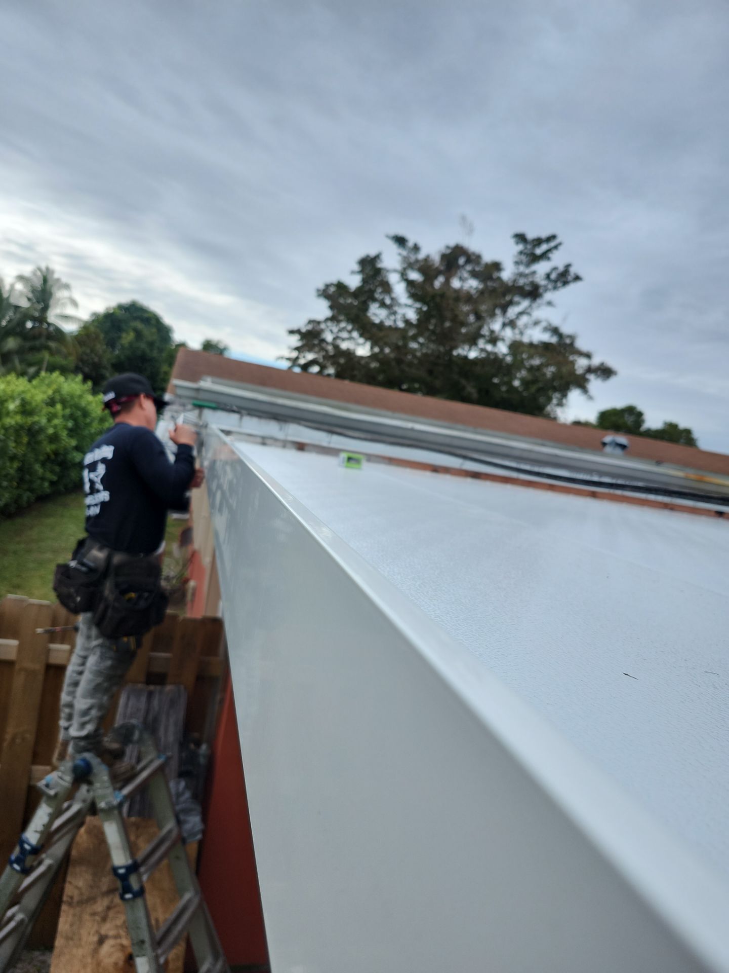 Insulated Screen Enclosure and Wood Tile Deck Installation in Plantation by Aastro Roofing