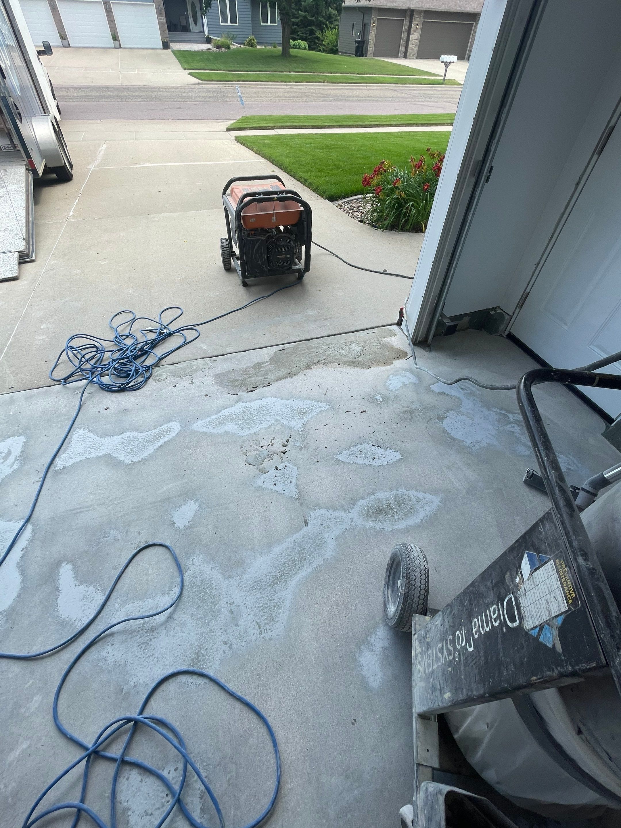 Multi-Car Garage Concrete Coating with Coyote Flake Finish in Sioux Falls by Select Painting, Coatings & Garage Cabinets