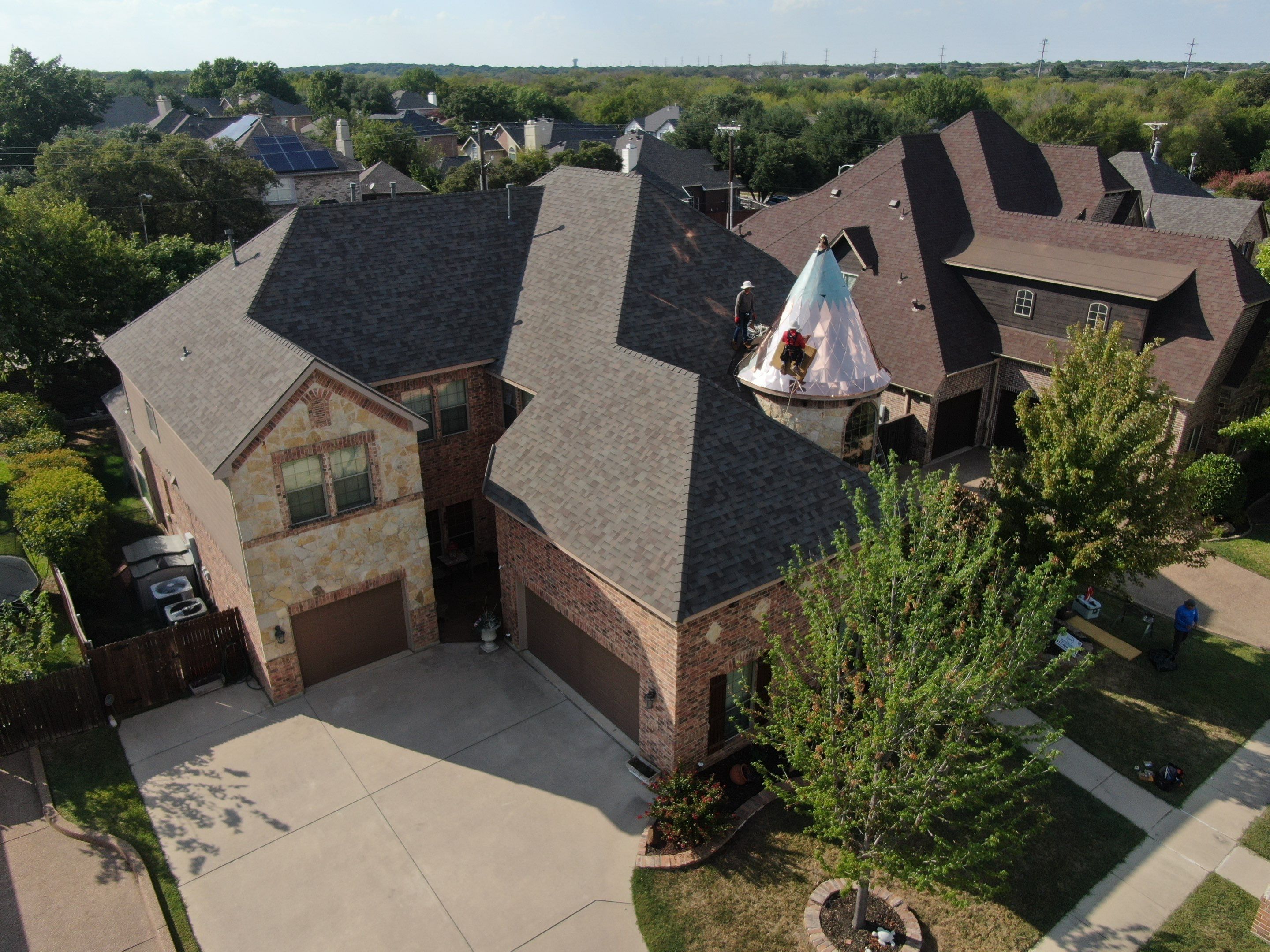 Installing Custom copper turret and Malarkey Vista Class 4 shingles Hail Damage Upgrade by Becker Roofing and Exteriors