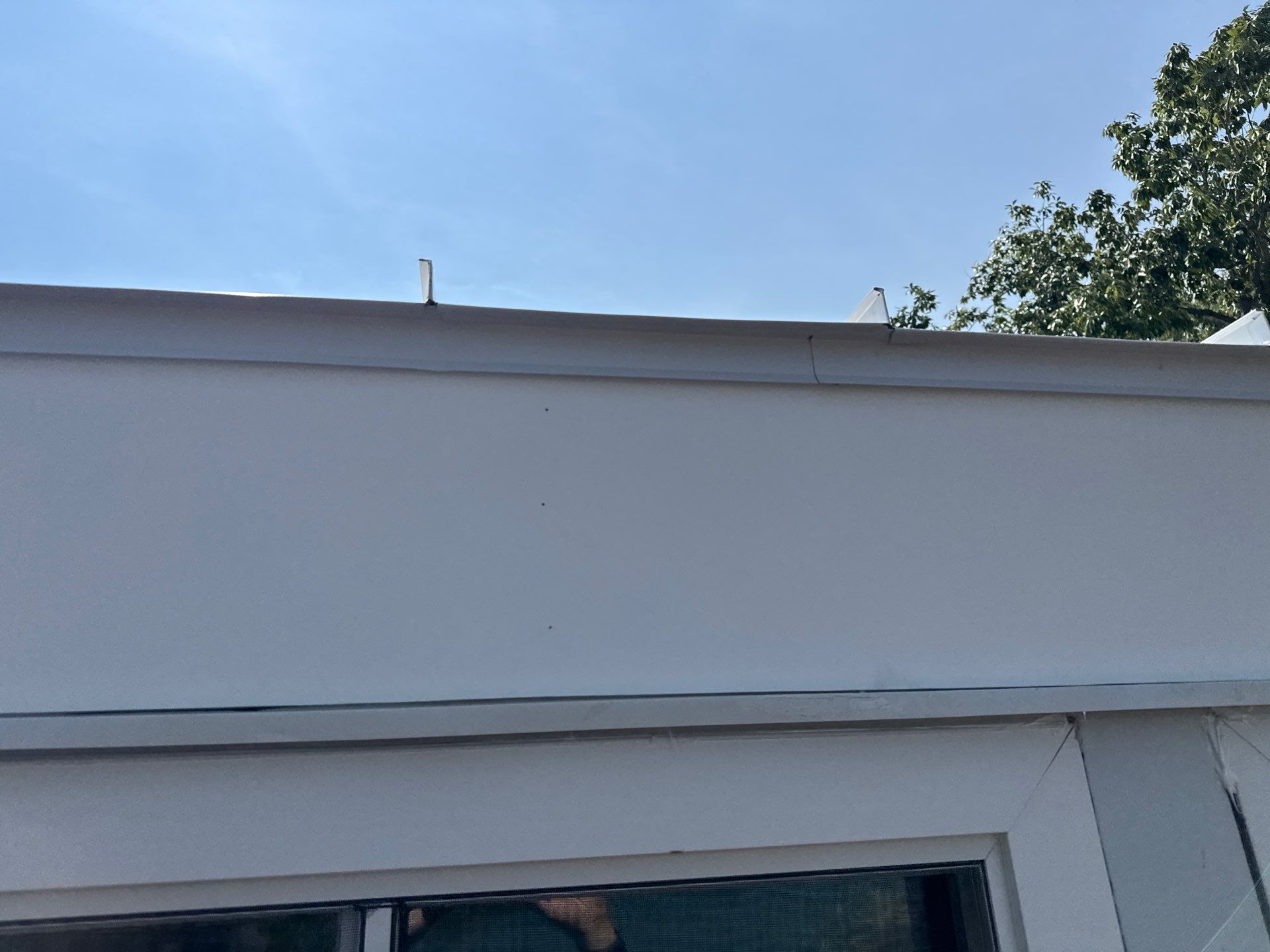 White Standing Seam Metal Roof Installation in Wake, VA by Cade Construction