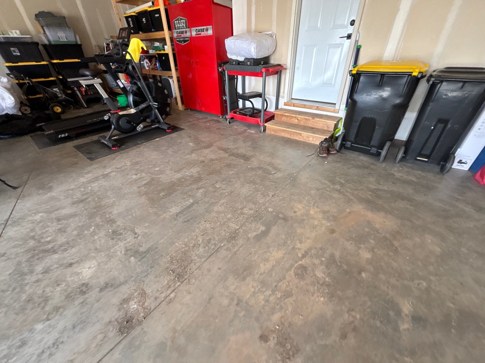 Grey Flake Epoxy Garage Floor Coating in Sioux Falls by Select Painting, Coatings & Garage Cabinets