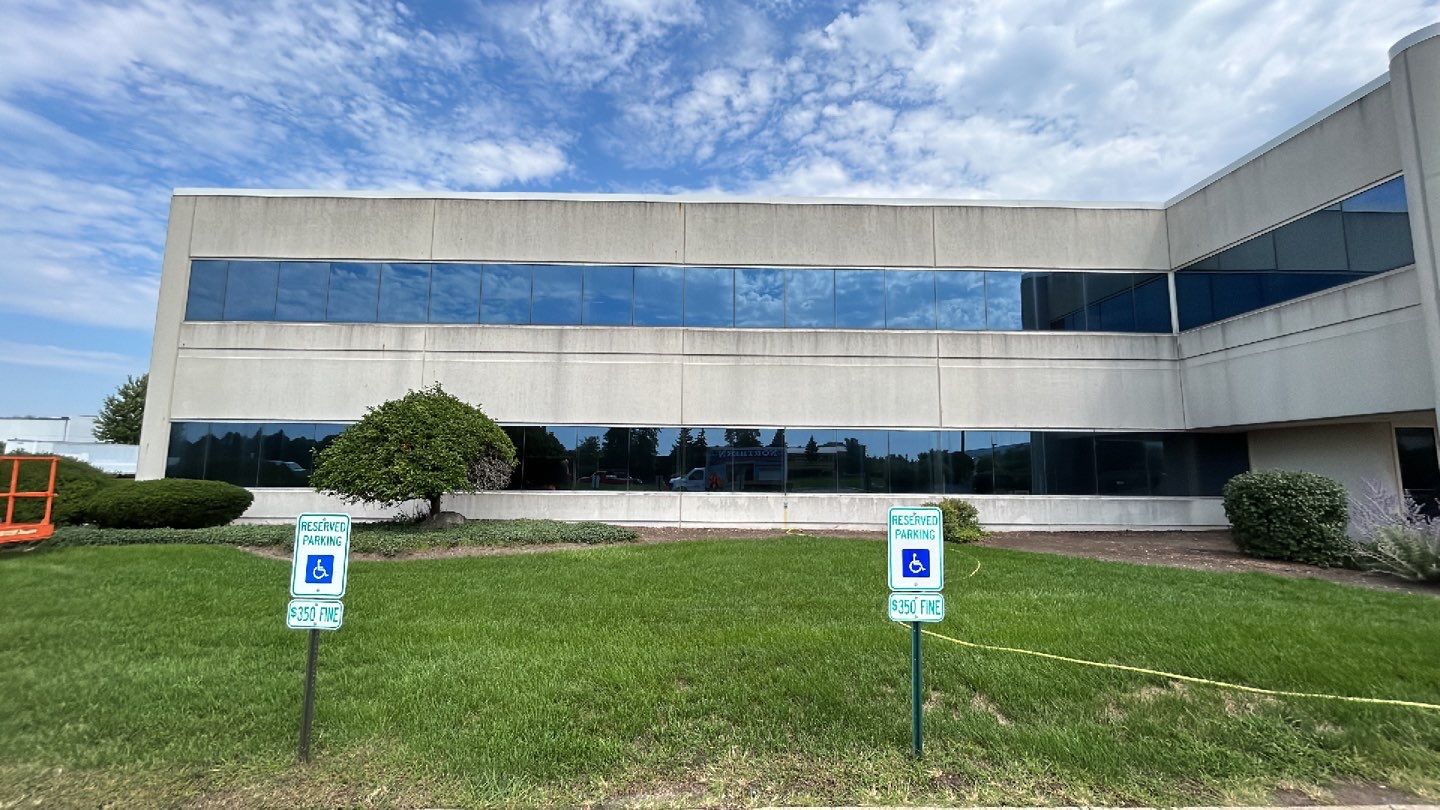 commercial pressure washing using Algaecide, soft wash soap by Northern Power Washing LLC.