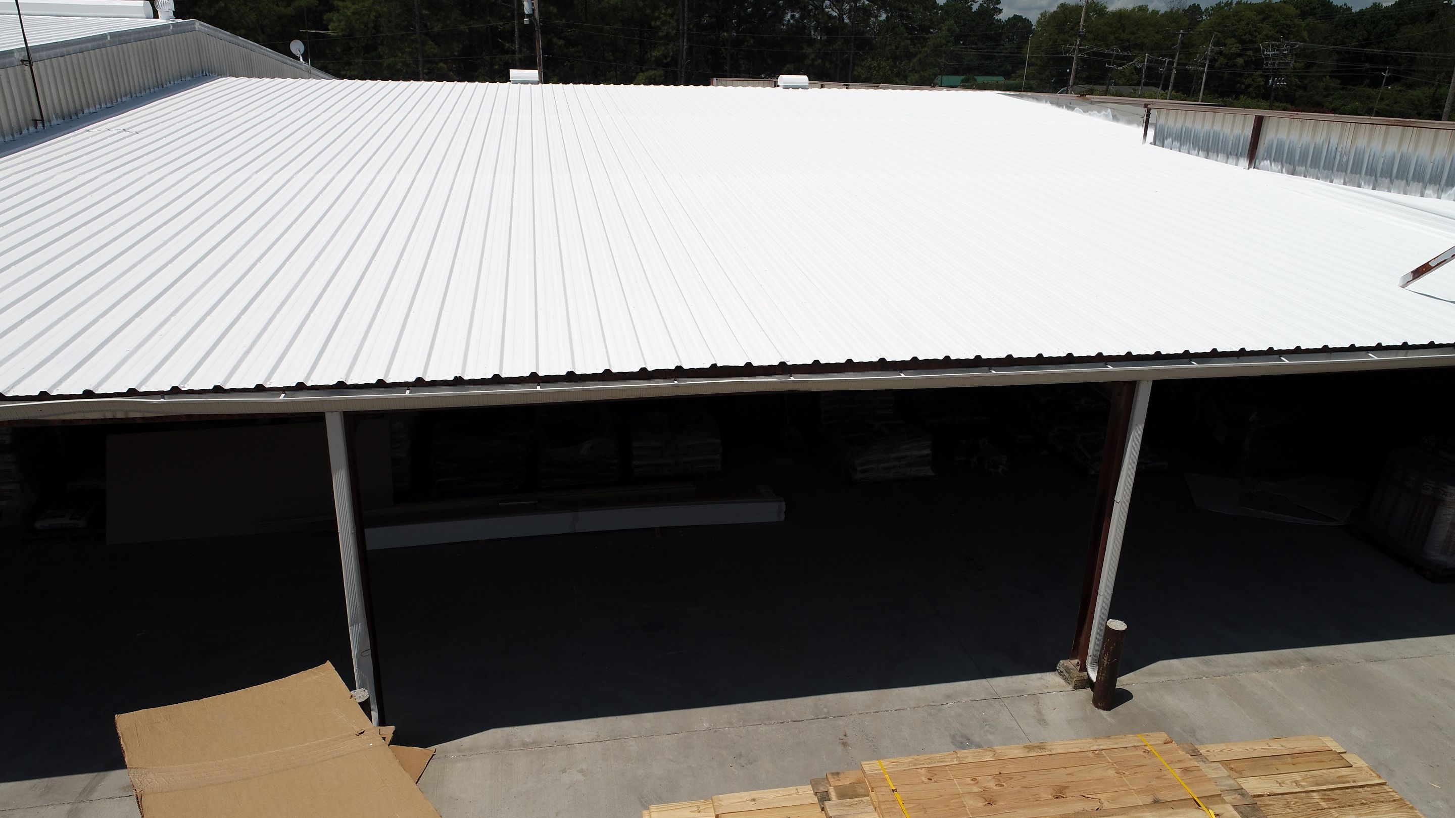 Commercial Roofing Installation using Aldocoat Coatings by Hostetler Roofing