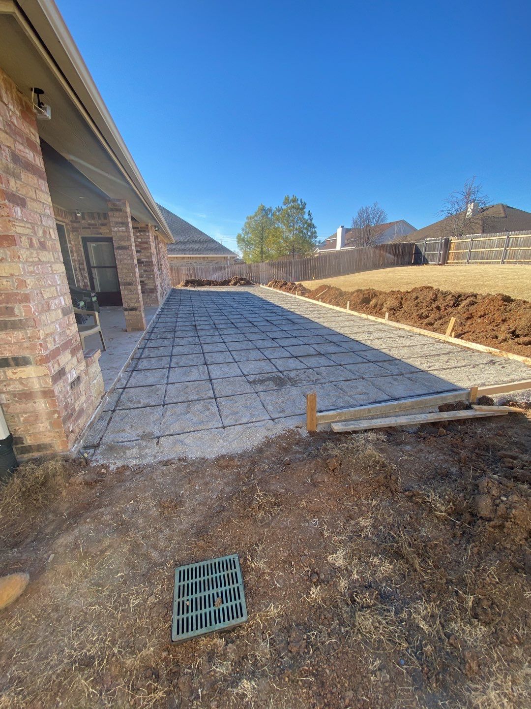 Concrete Slab , Retaining Wall , Fence, and landscape. by Clays Services Inc