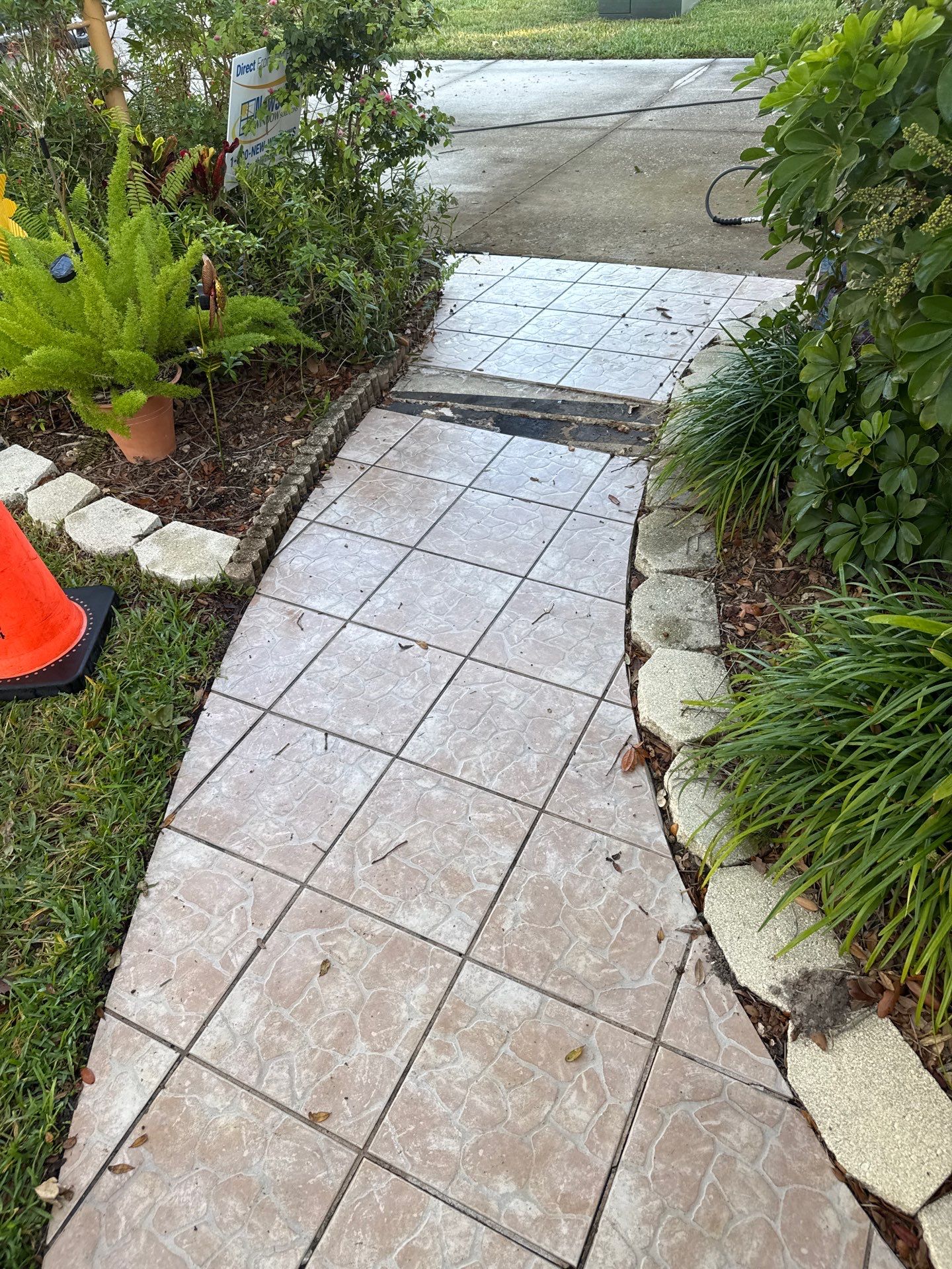 Concrete Driveway, Entryway, Flowerbed Curbing & Statue Cleaning in Heather Glen, Palmetto, FL | Sunshine AquaWash by Sunshine AquaWash