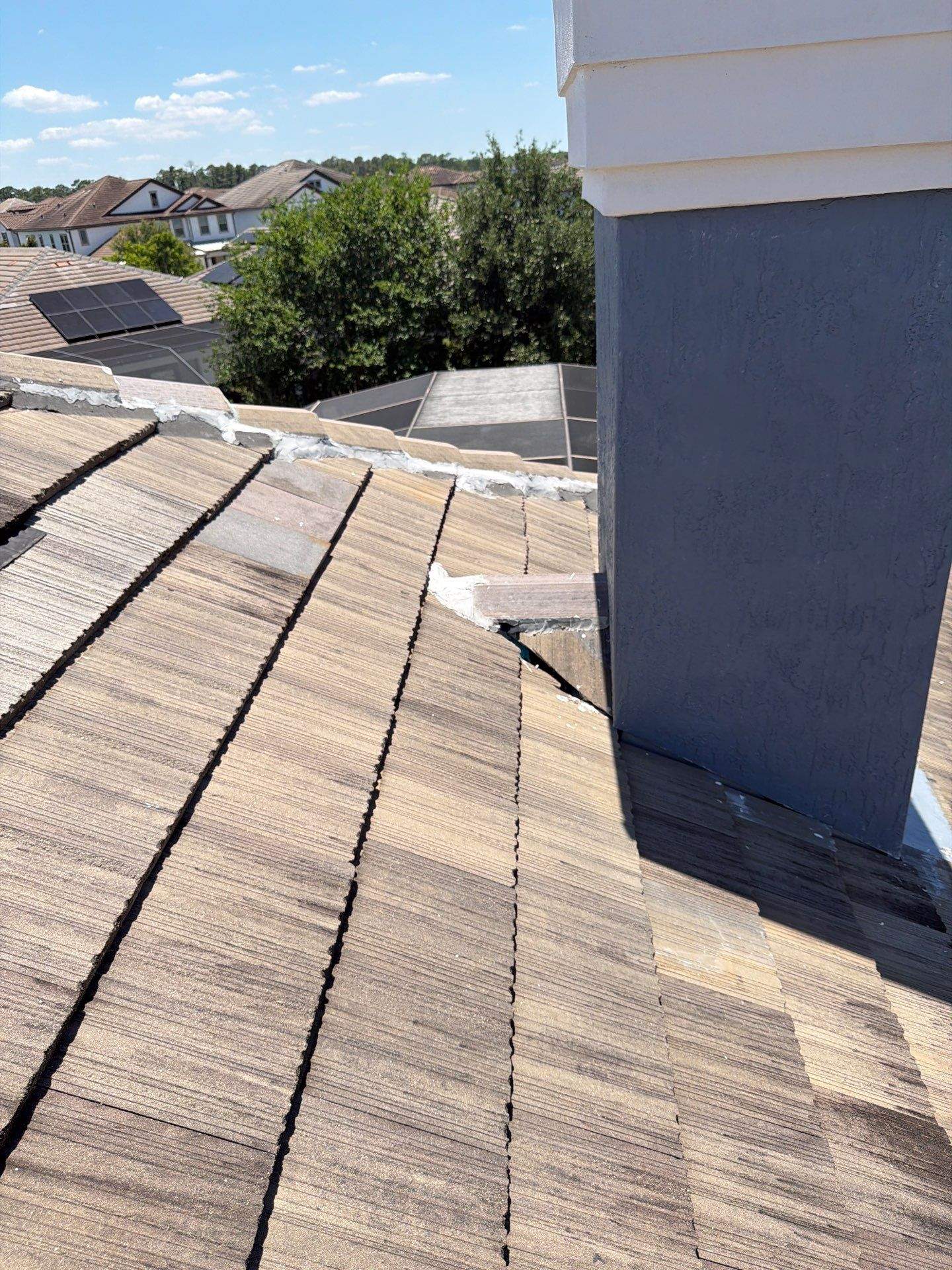 Winter Park Concrete Tile Roof Replacement and Chimney Flashing Installation by Fortified Roofing Solutions Corp.