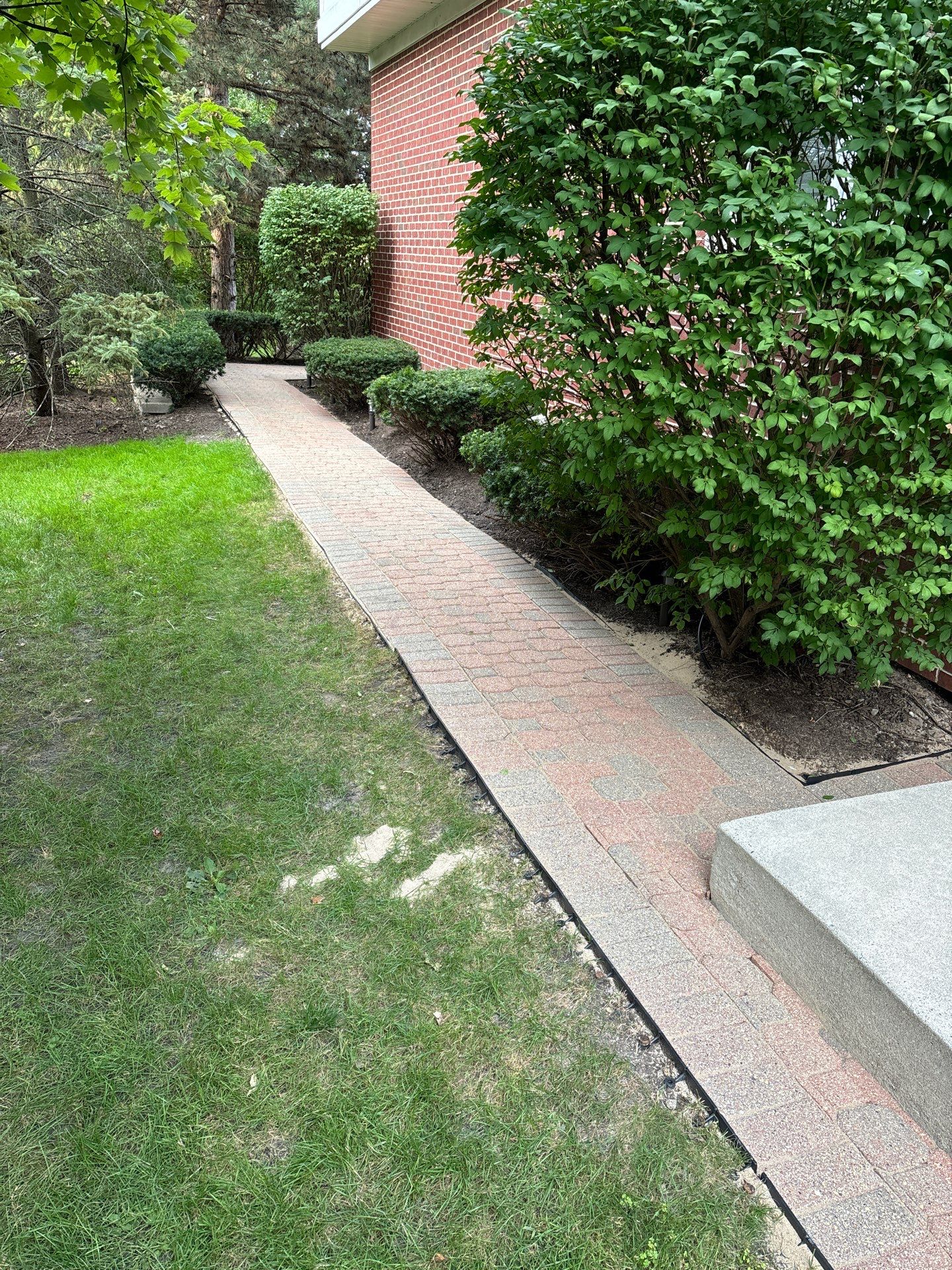 Brick paver repair, clean and seal by Northern Power Washing LLC.