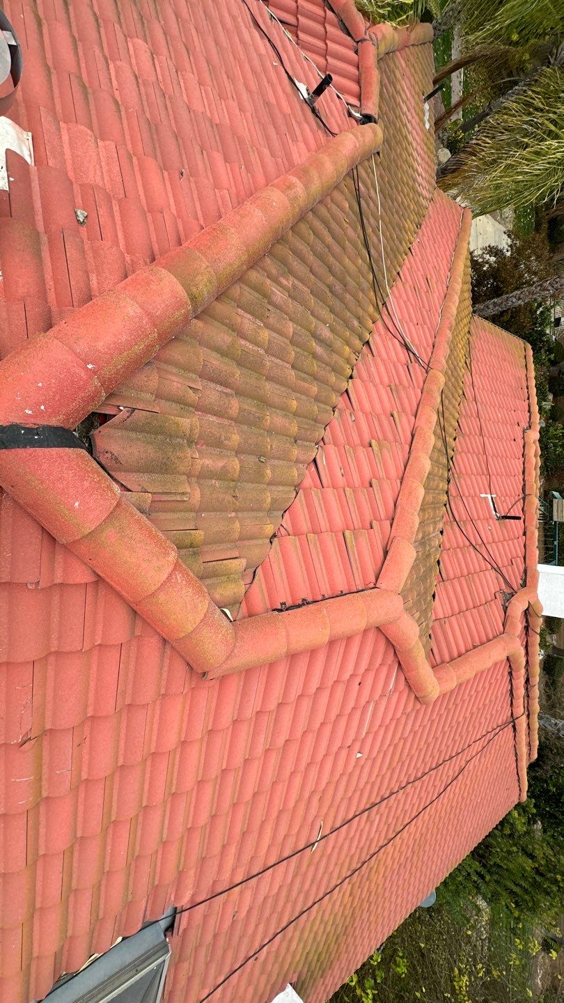 Tile refurbish project using existing tiles and replaced underlayment and battens by Straight Edge Roofing Inc