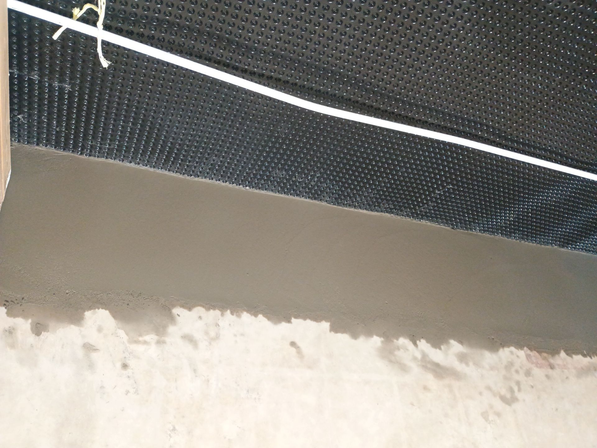 Interior Drain Tile & Foundation Crack Repair in St. Anthony, MN by Waterproofing Northeast