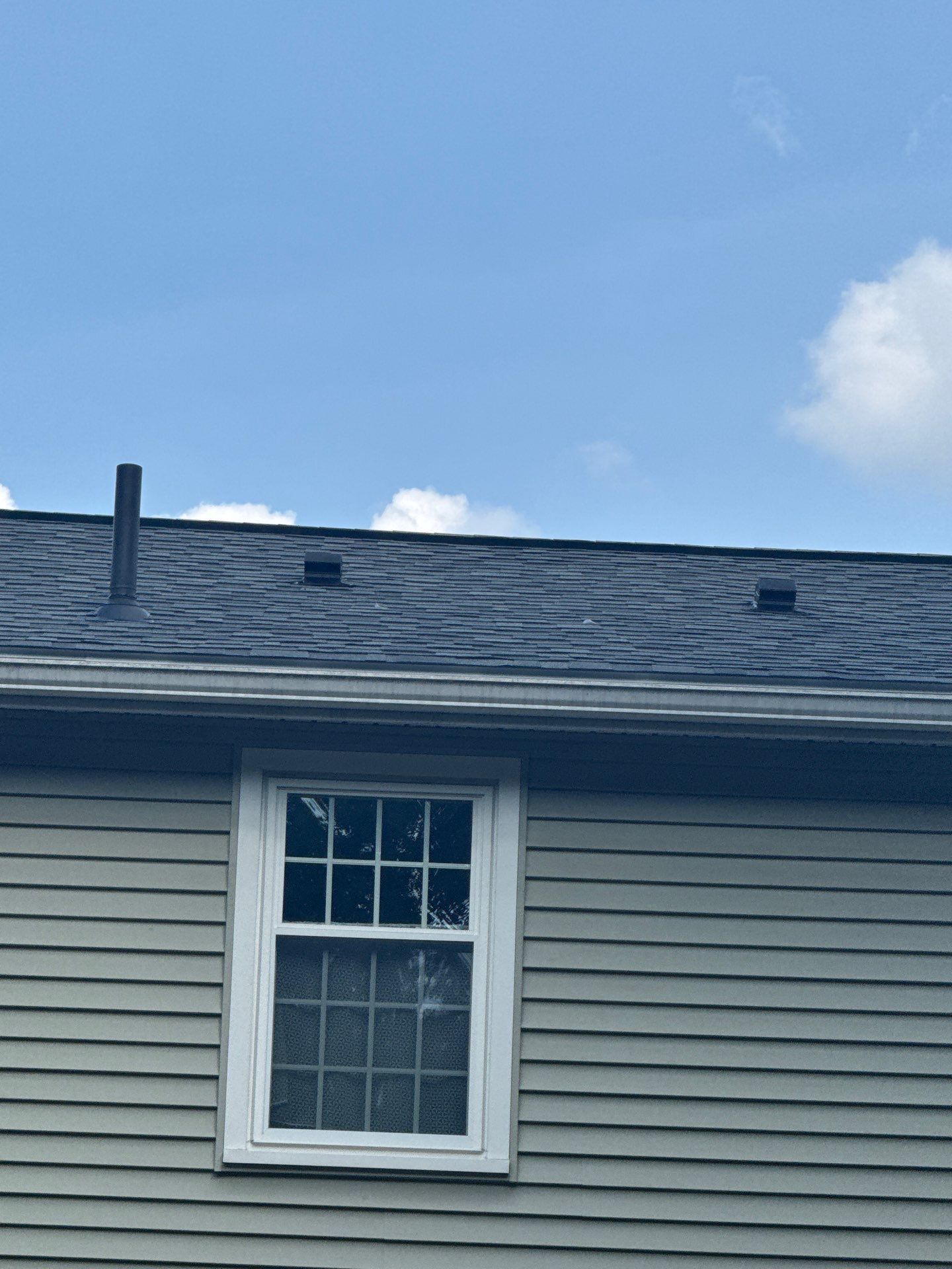 Complete Roof Replacement with Chimney Flashing, Gutter Guard System, and Vinyl Siding Repairs by Mighty Dog Roofing of Greater Middlesex County