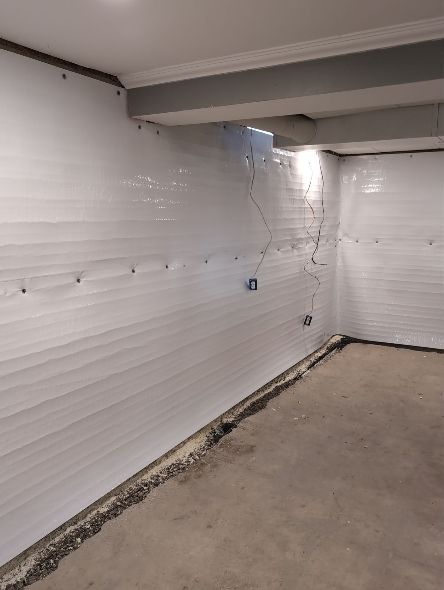 Interior Basement Waterproofing System and Egress Window Installation by Toledo Basement Repair 