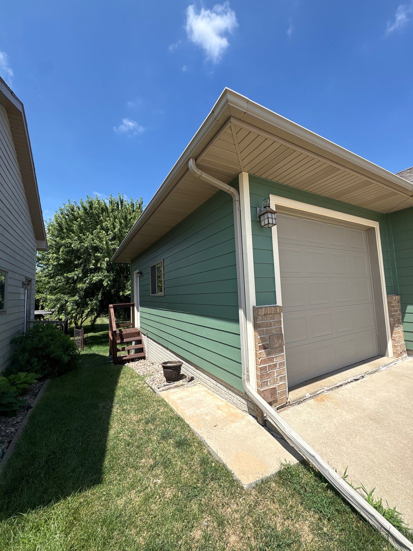Full Exterior Residential Painting and Siding Refresh in Tea by Select Painting, Coatings & Garage Cabinets