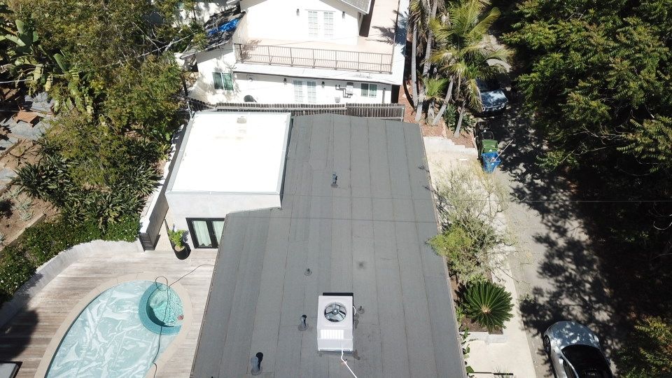 Residential Roofing Installation using Polyfresko® G Highly Reflective Modified Bitumen Cap Sheet by Hull Brothers Roofing