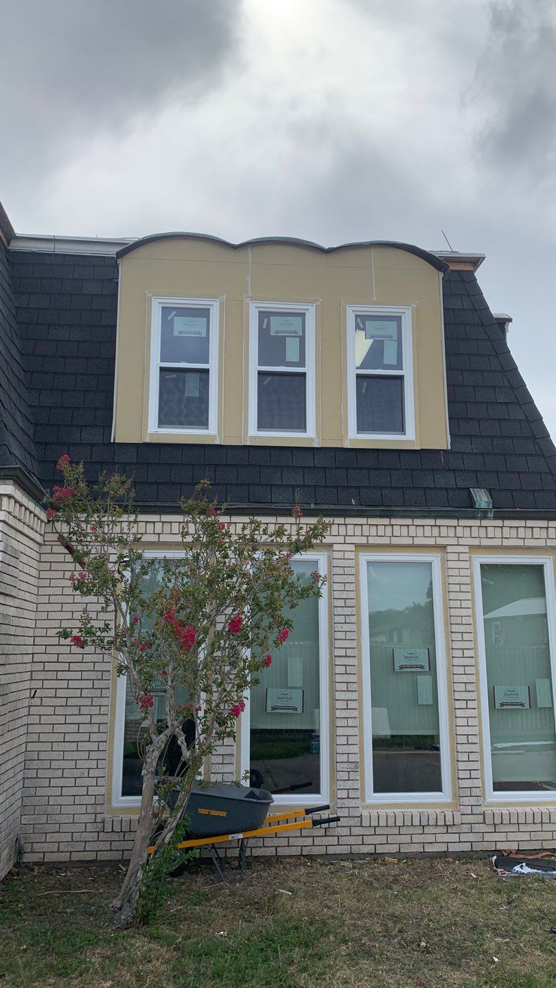 Mansard Charm by Bayfront Roofing and Construction