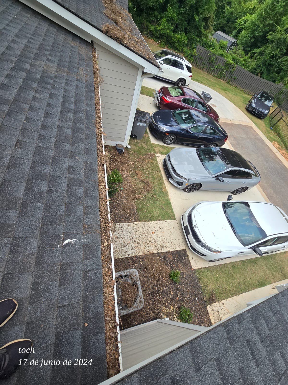 Commercial gutter cleaning Simpsonville & Easley, SC before photo with filled gutters