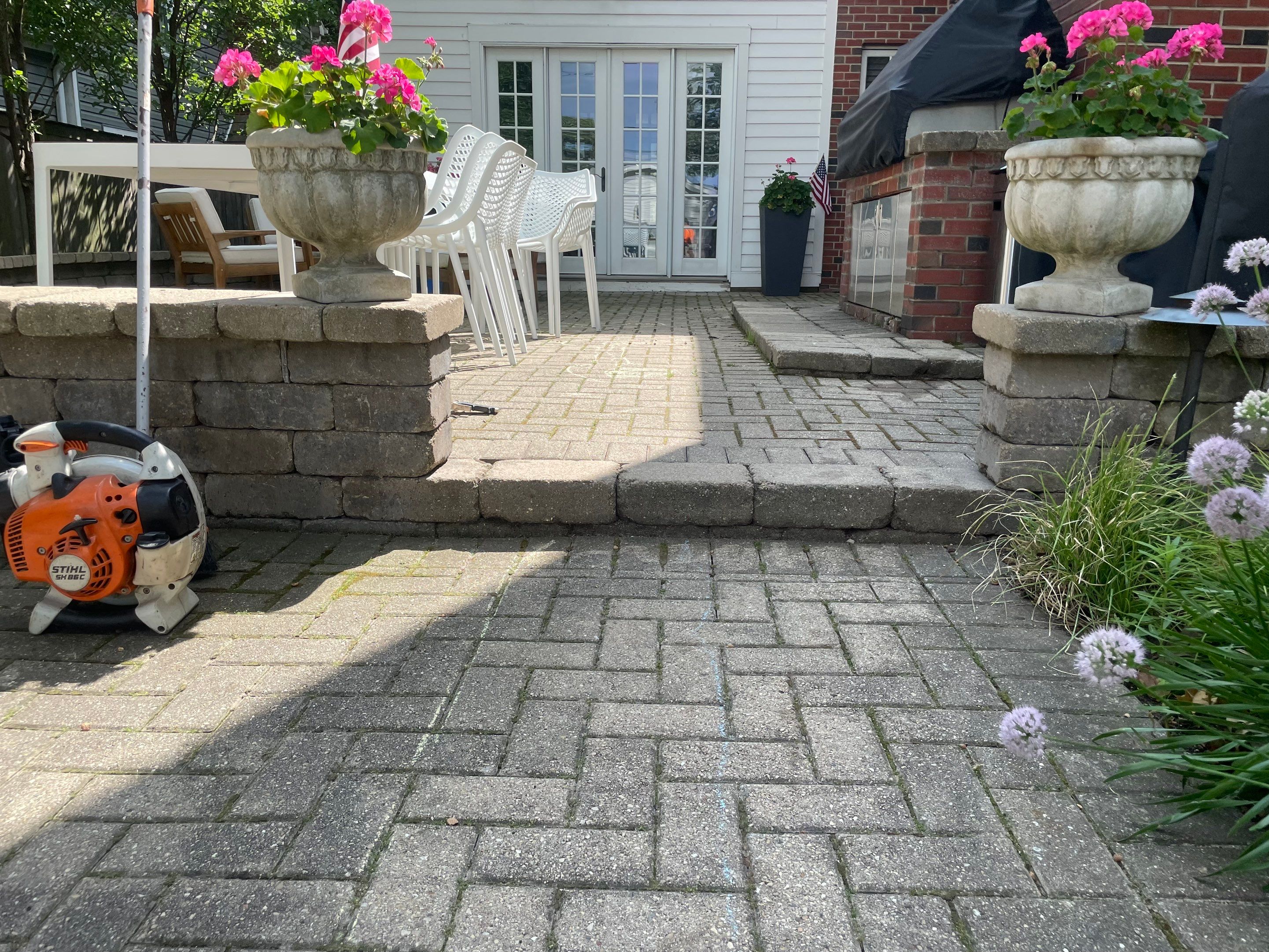 Brick patio repair, clean sand and seal by Northern Power Washing LLC.