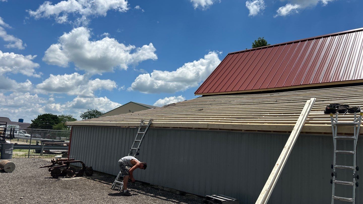 Residential Roofing Installation using Standing Seam Metal - Barn Red by RoofX 
