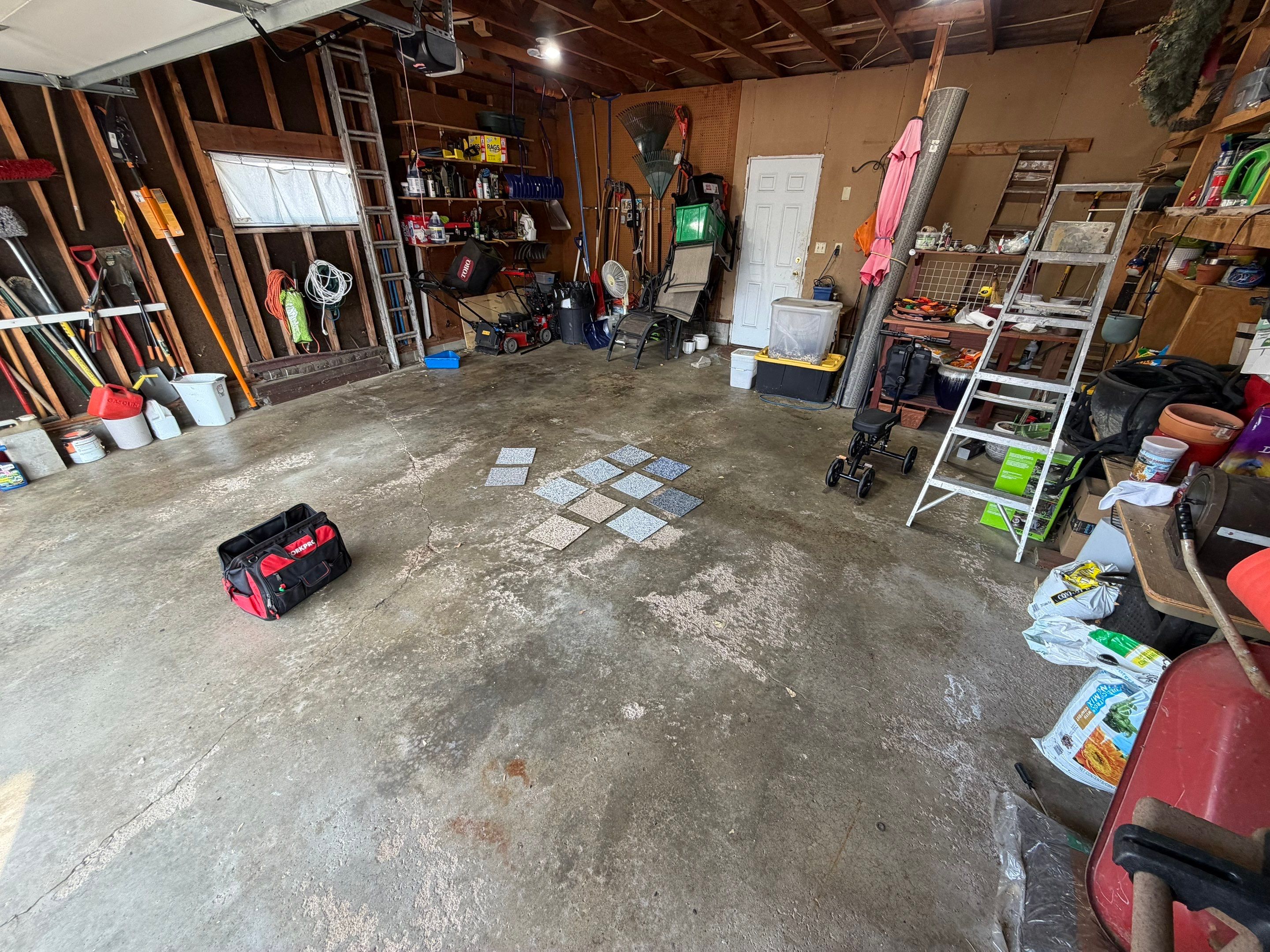 Sioux Falls Garage Epoxy Floor Installation and Concrete Crack Repair by Select Painting, Coatings & Garage Cabinets