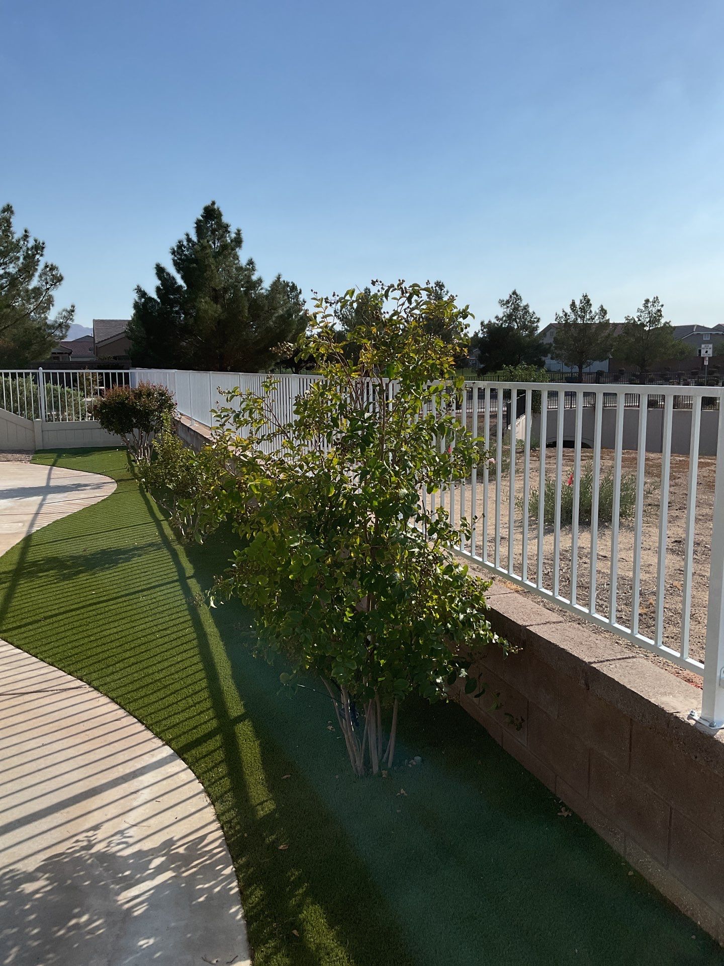 3ft White Wrought Iron on Block Wall by Fence Guys Inc. 