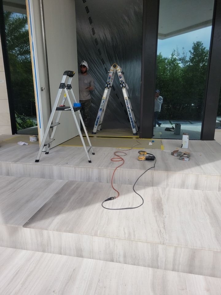 Custom Material Pivot Door installation by Impact Precious Windows and Doors