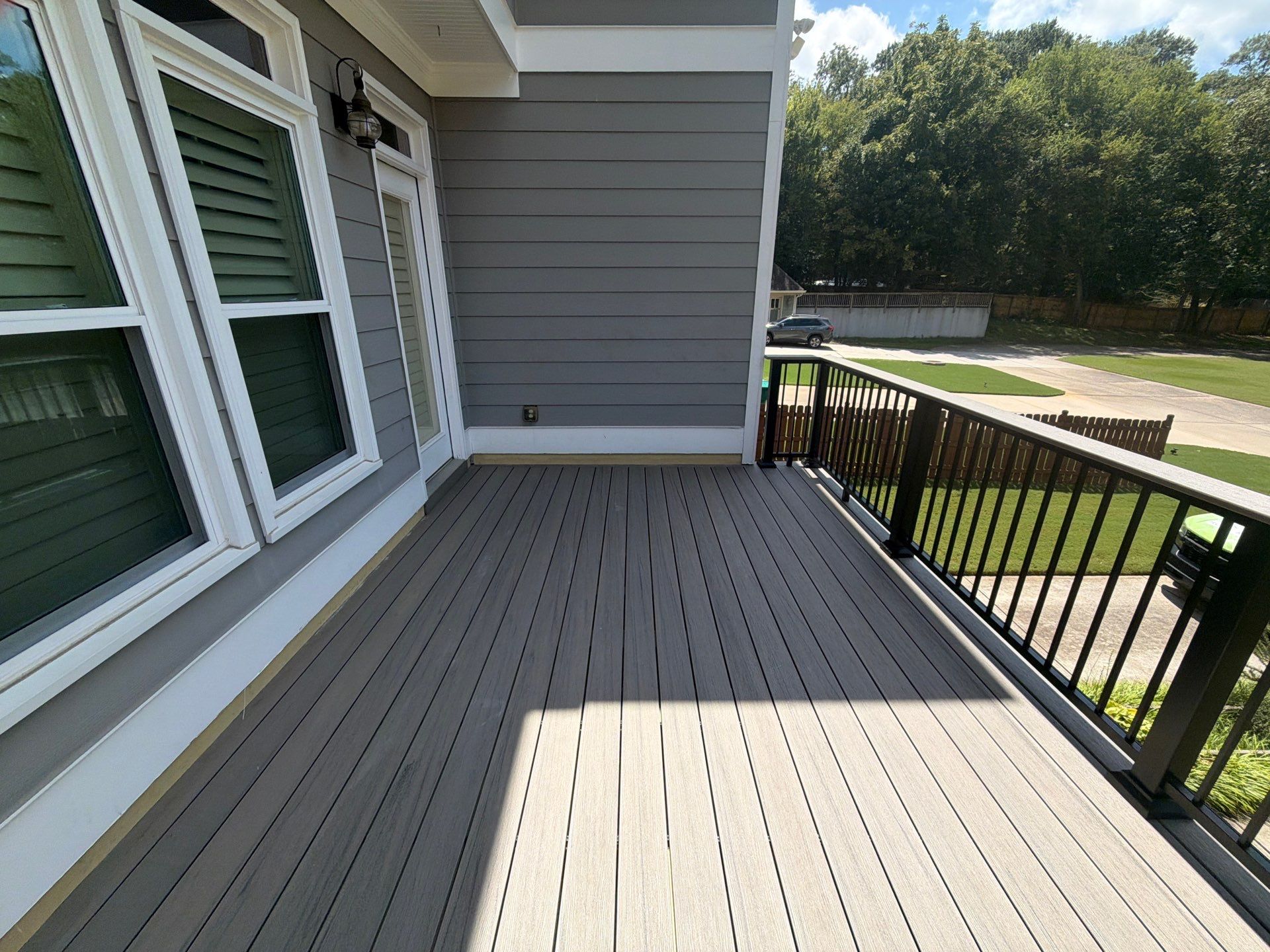 Elevated Composite Deck Replacement with Metal Railings in Smyrna by Swift Home Renovations 