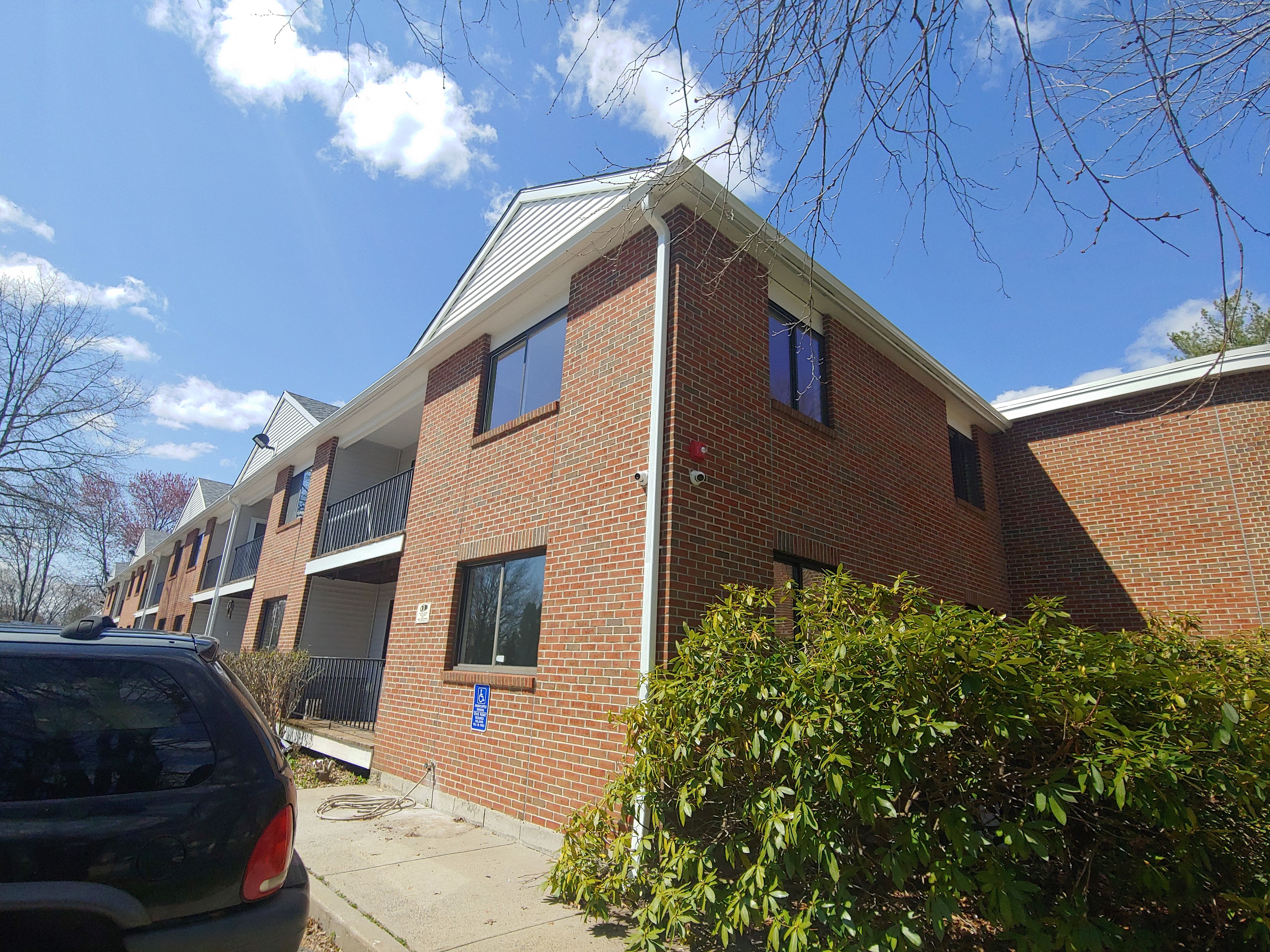 Commercial Roofing Installation using EPDM with white gutters by A Plus Exterior