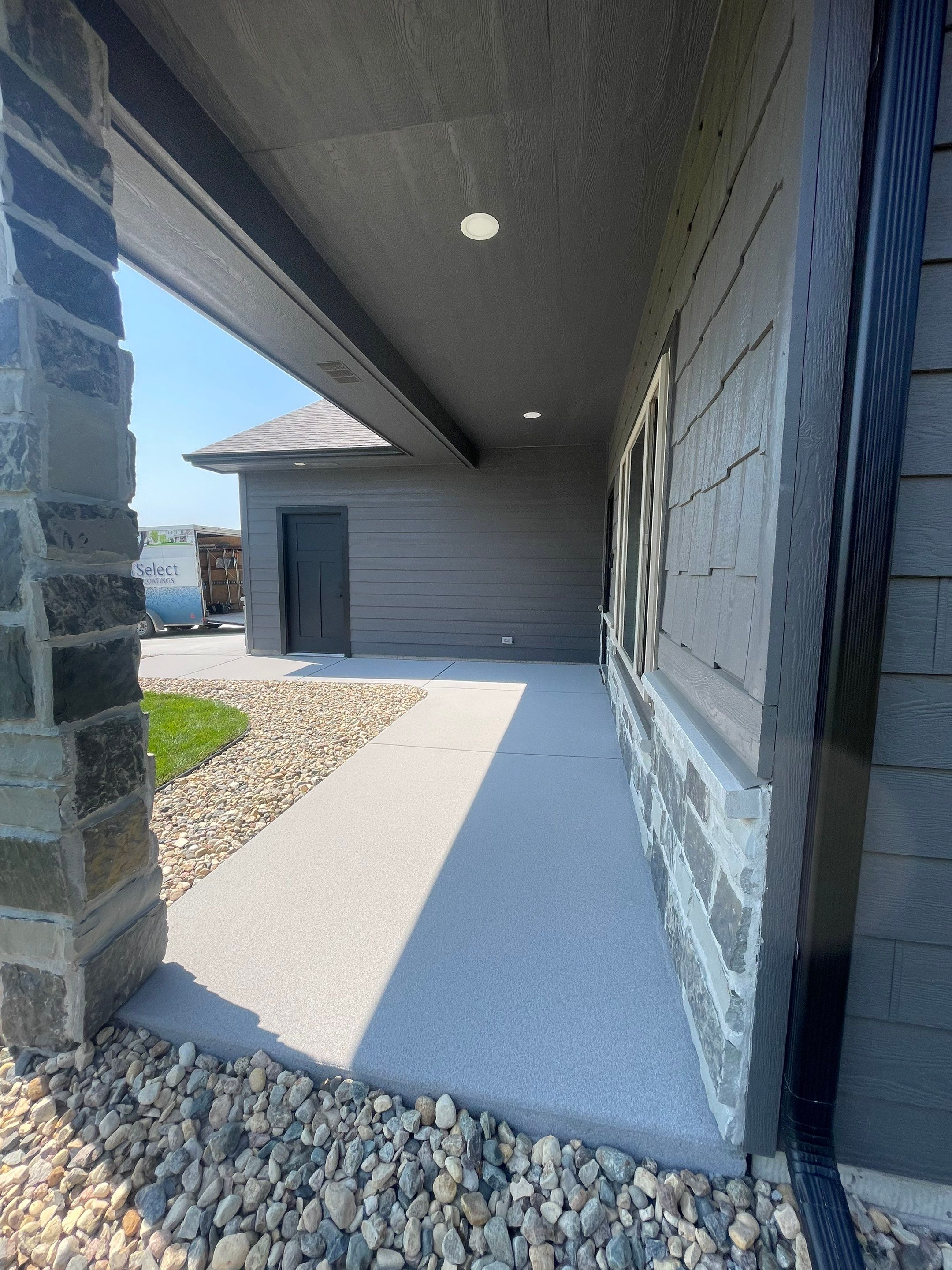 Sioux Falls Residential Concrete Patio and Walkway Coating by Select Painting, Coatings & Garage Cabinets