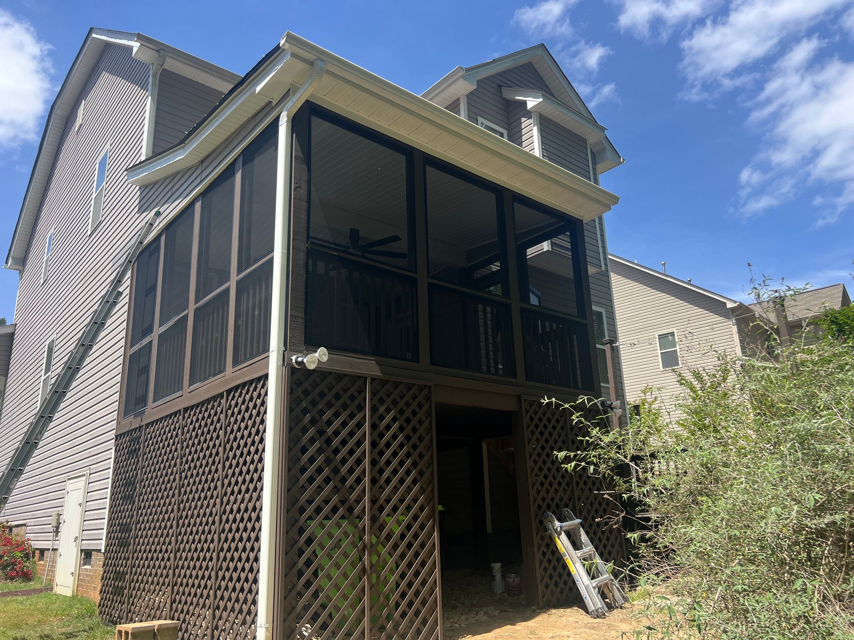 Elevated Screened Porch Addition and Deck Integration in Knightdale by The Remodeling Company