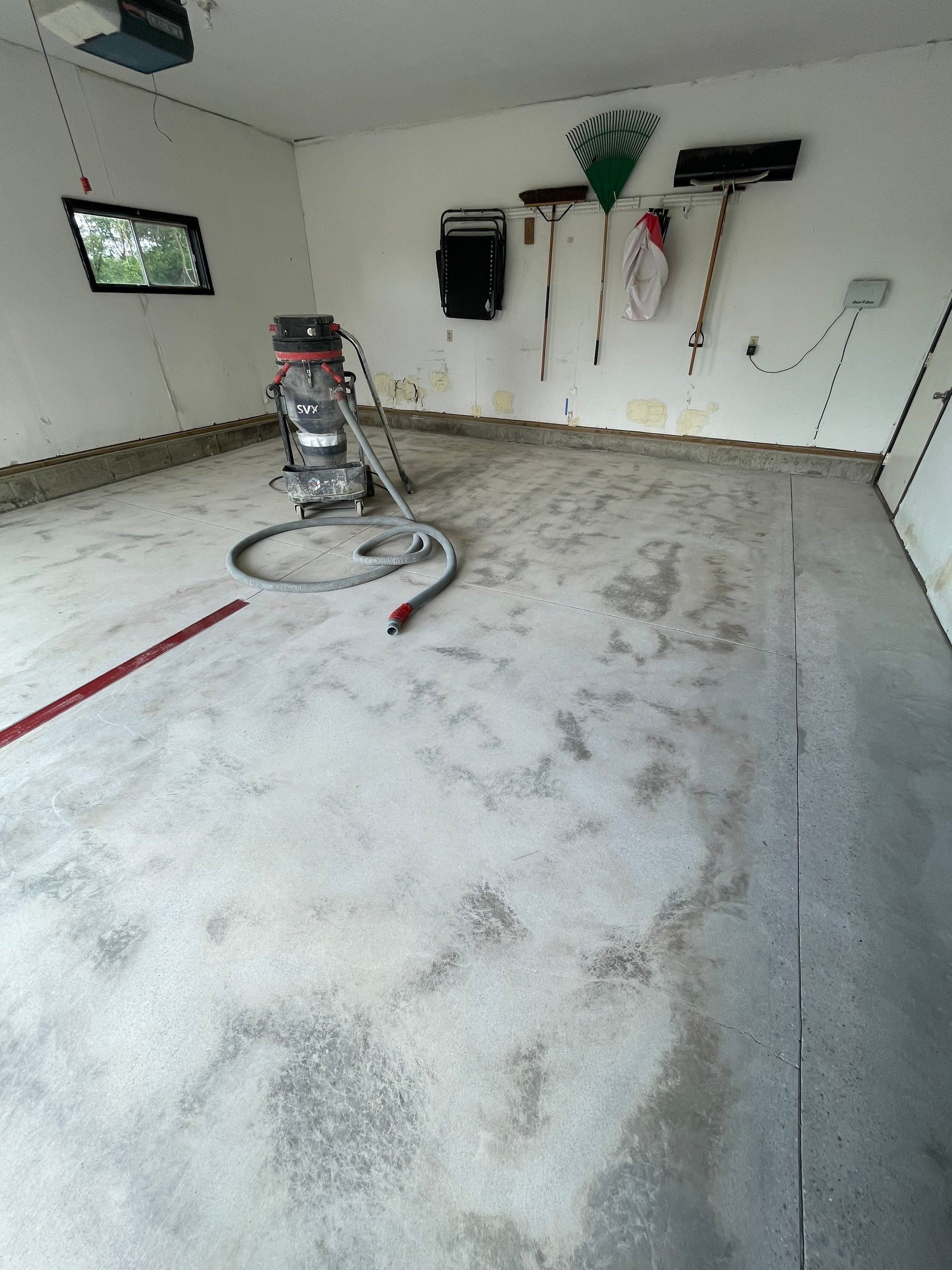 Hartford Residential Garage Floor Transformation With Decorative Chip Coating by Select Painting, Coatings & Garage Cabinets