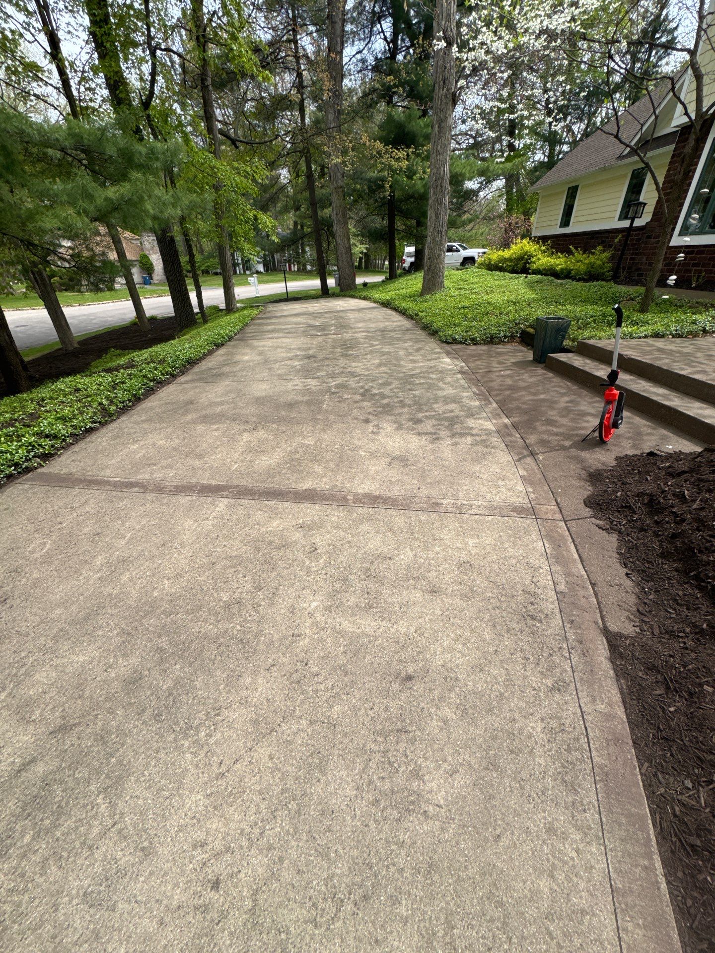 Concrete Driveway and Walkway Staining With Espresso Borders in Grand Rapids by Gordon Painting