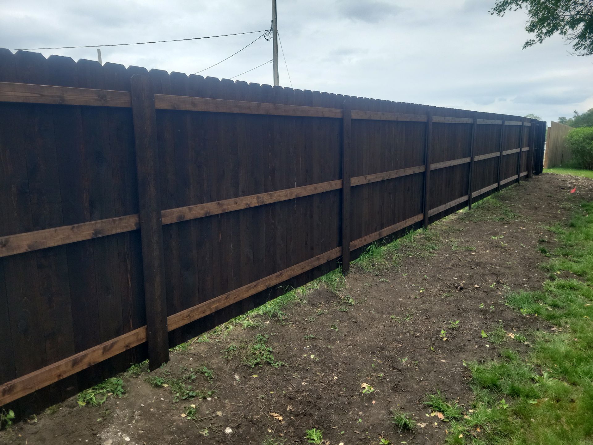 Chain Link and Cedar Privacy in Grundy Center by Perfect Picket Fence and Stain