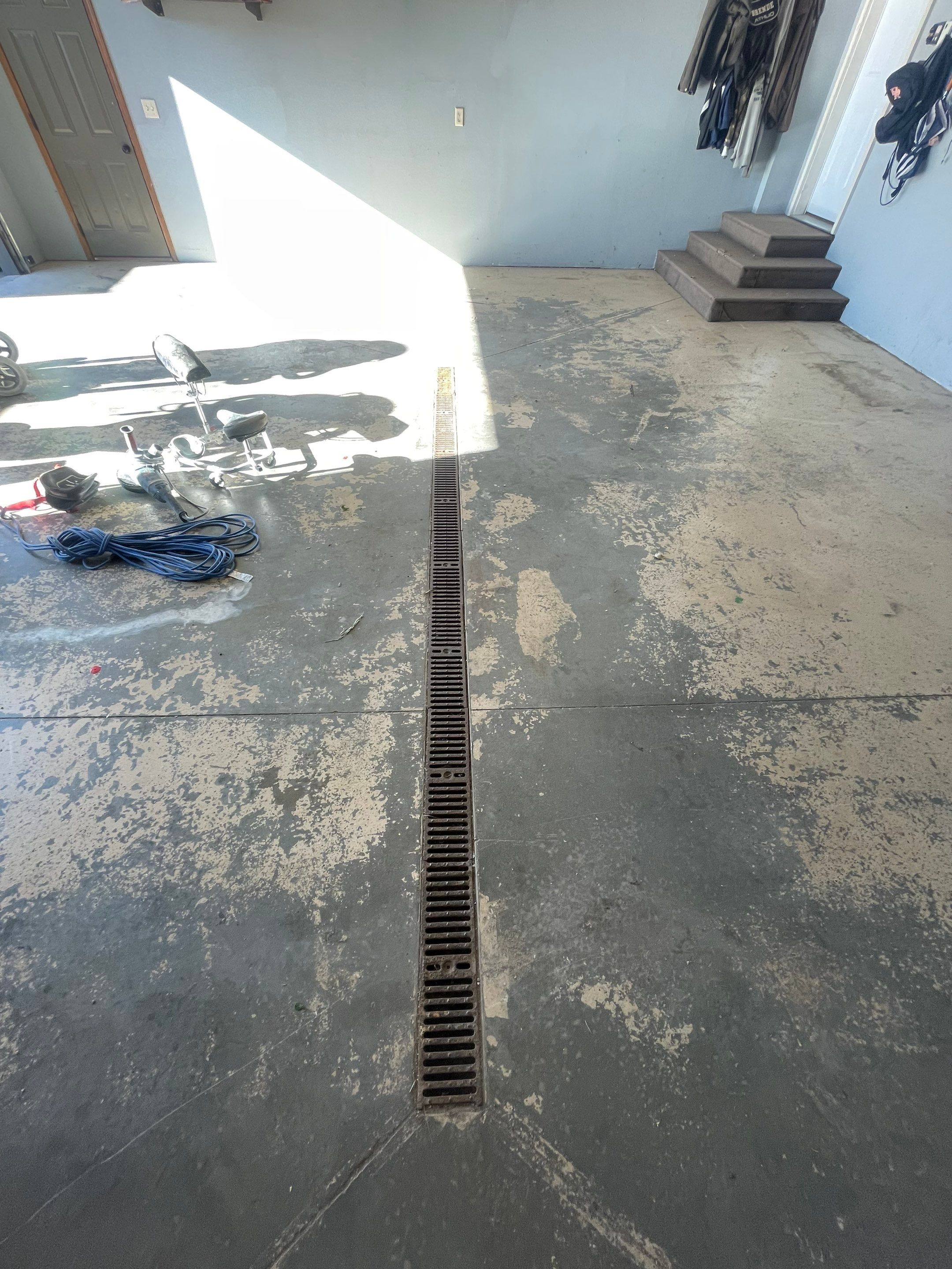 Full Garage Floor Epoxy Coating Installation in Dell Rapids by Select Painting, Coatings & Garage Cabinets