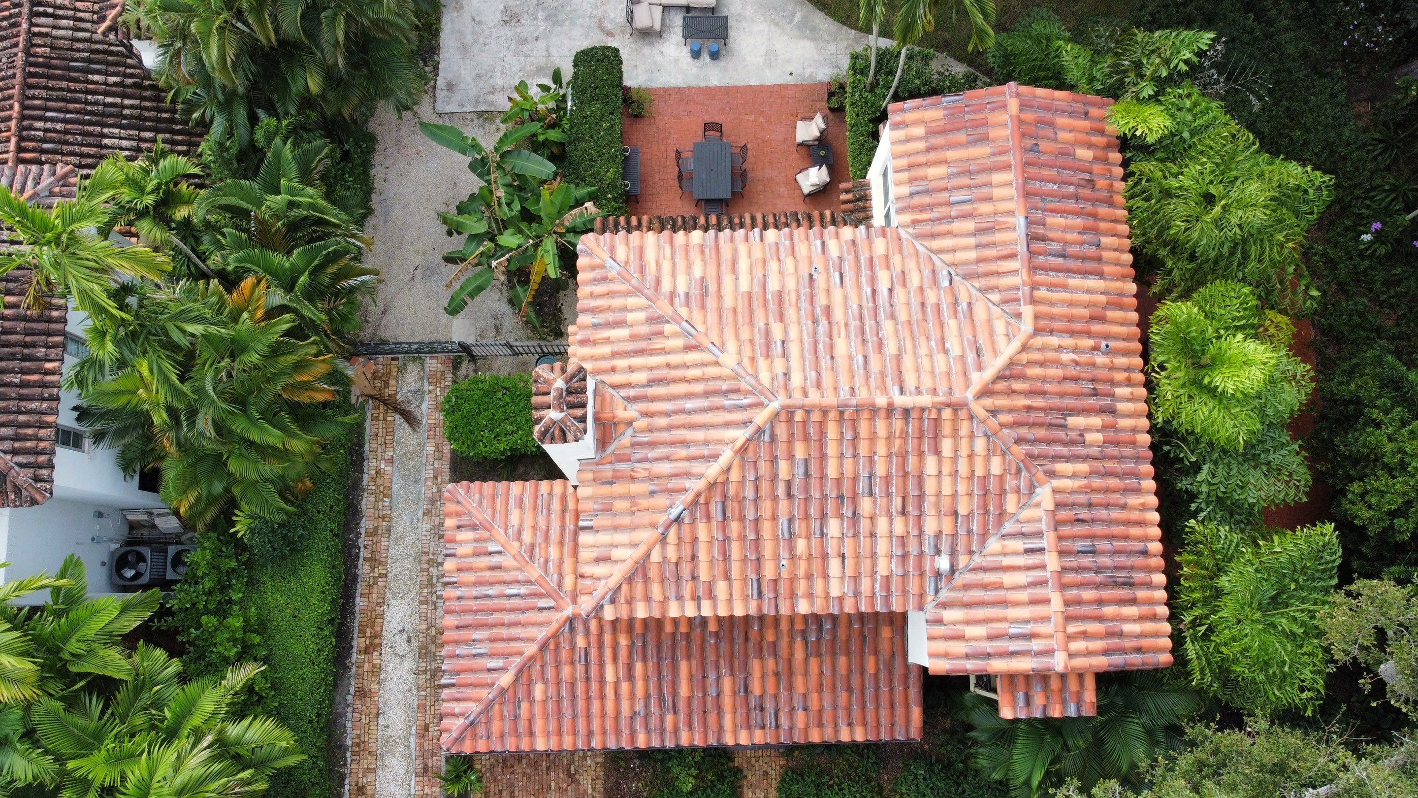Residential Roofing Installation using Two Piece Clay Barrel Tile with a mortar set application by BOB HILSON & CO INC