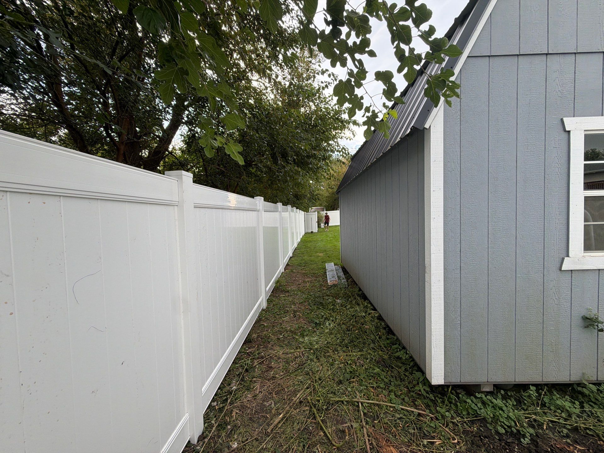 White Vinyl Privacy Fence Installation in Raymond, IA by Perfect Picket Fence and Stain