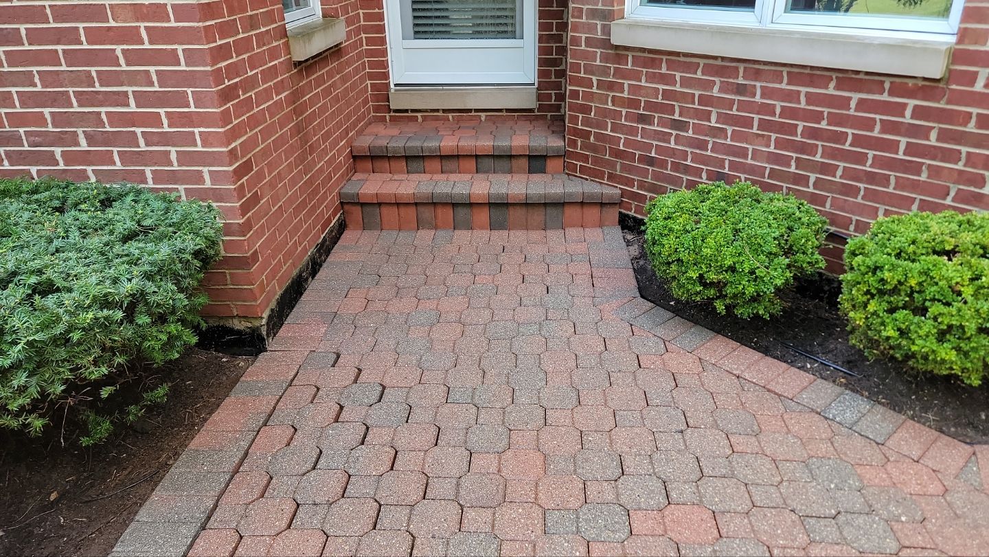 Brick paver repair, clean and seal by Northern Power Washing LLC.